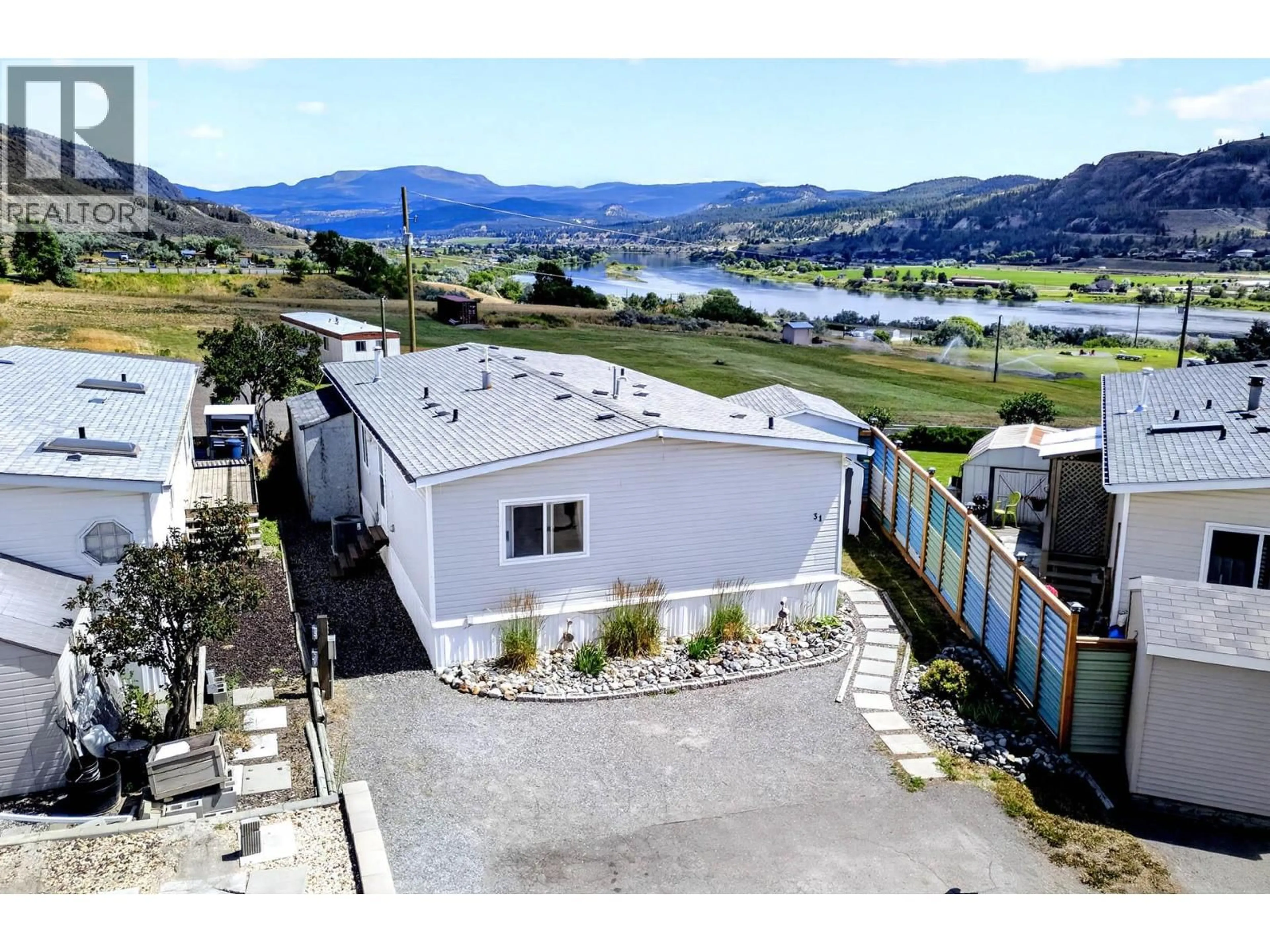 A pic from outside/outdoor area/front of a property/back of a property/a pic from drone, water/lake/river/ocean view for 31 - 3099 SHUSWAP ROAD, Kamloops British Columbia V2H1T7