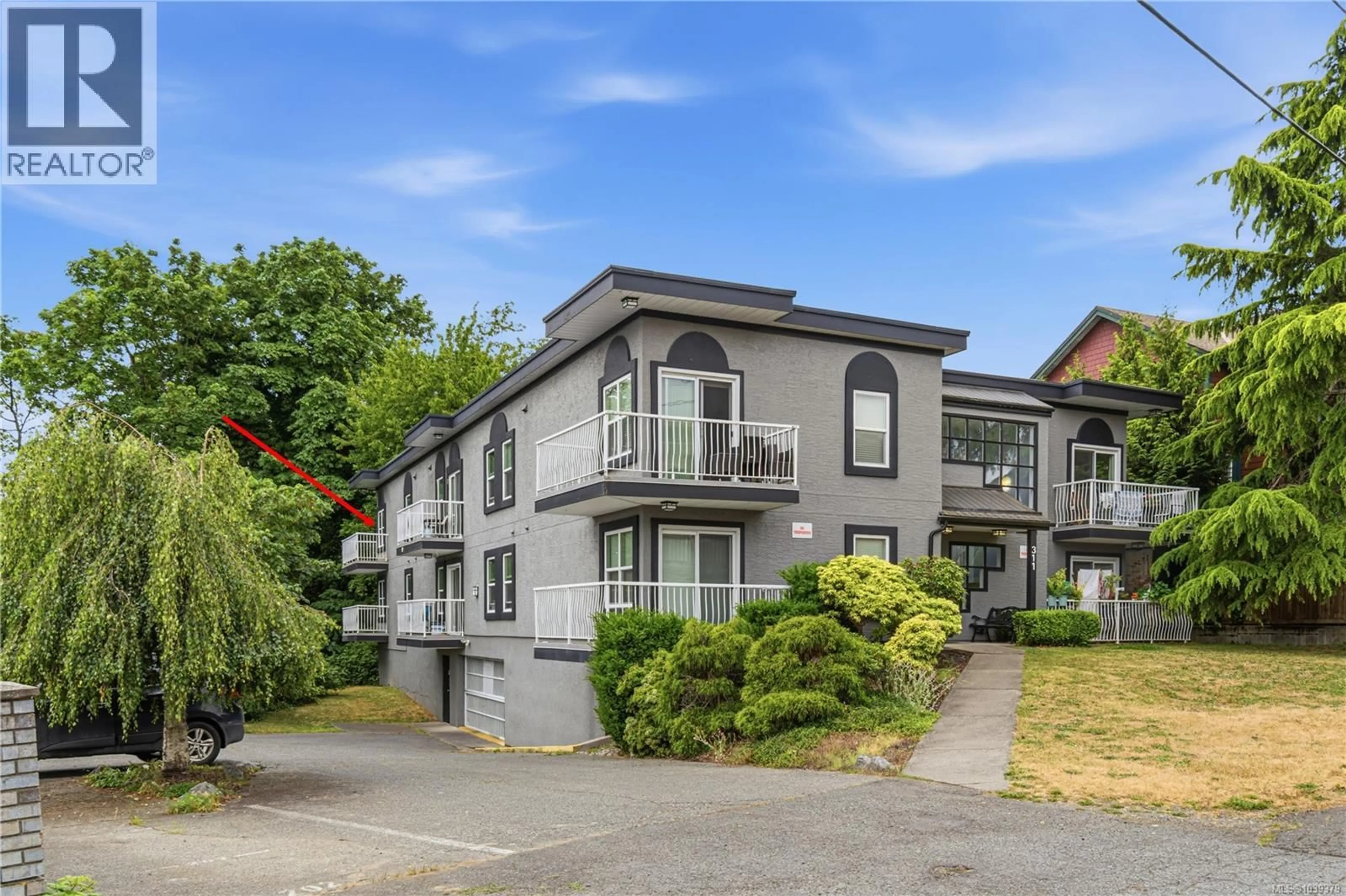A pic from outside/outdoor area/front of a property/back of a property/a pic from drone, unknown for 205 - 311 MT. BENSON STREET, Nanaimo British Columbia V9S1B7