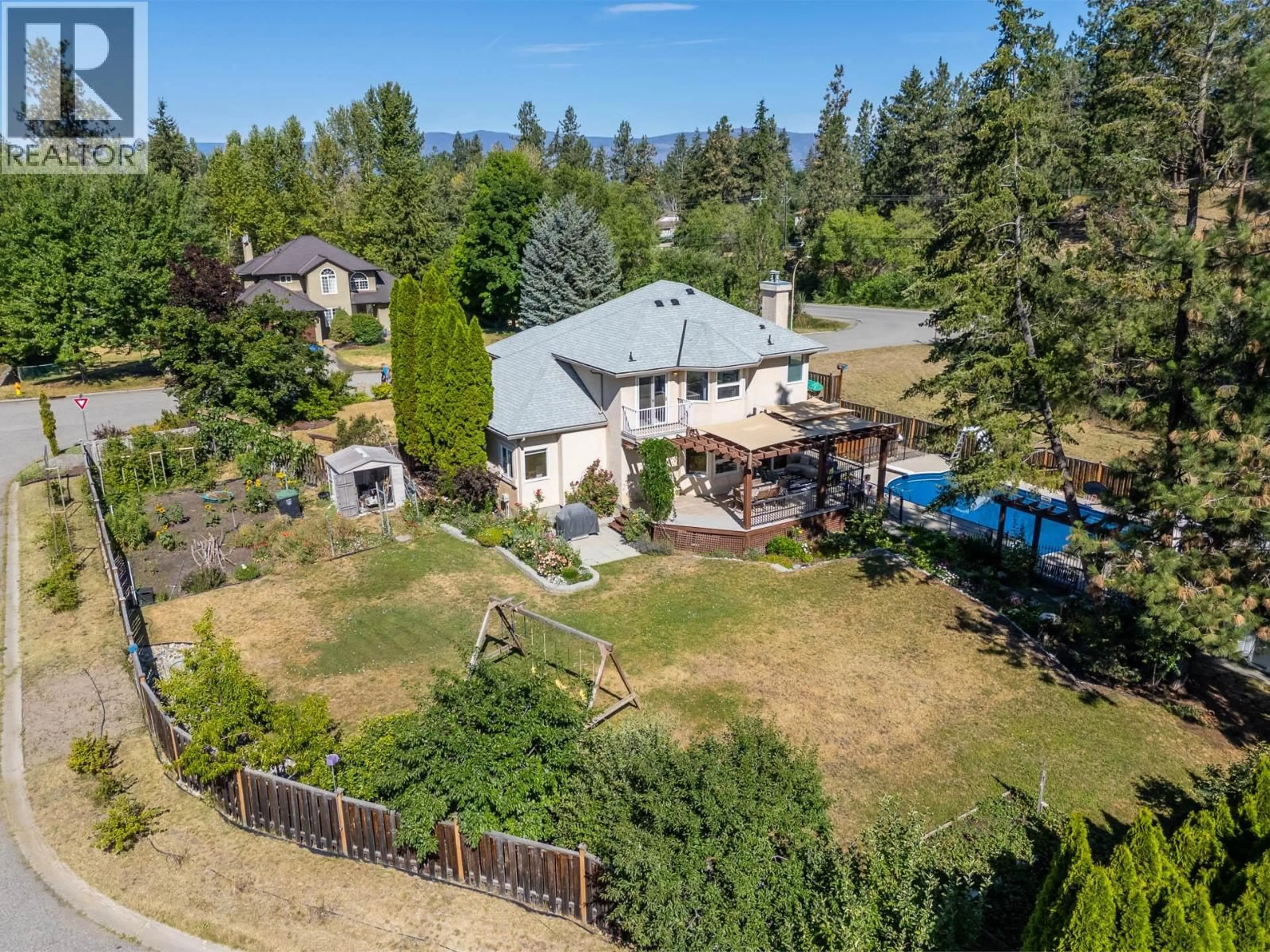A pic from outside/outdoor area/front of a property/back of a property/a pic from drone, unknown for 4015 MAHONIA DRIVE, Kelowna British Columbia V1W3Y2