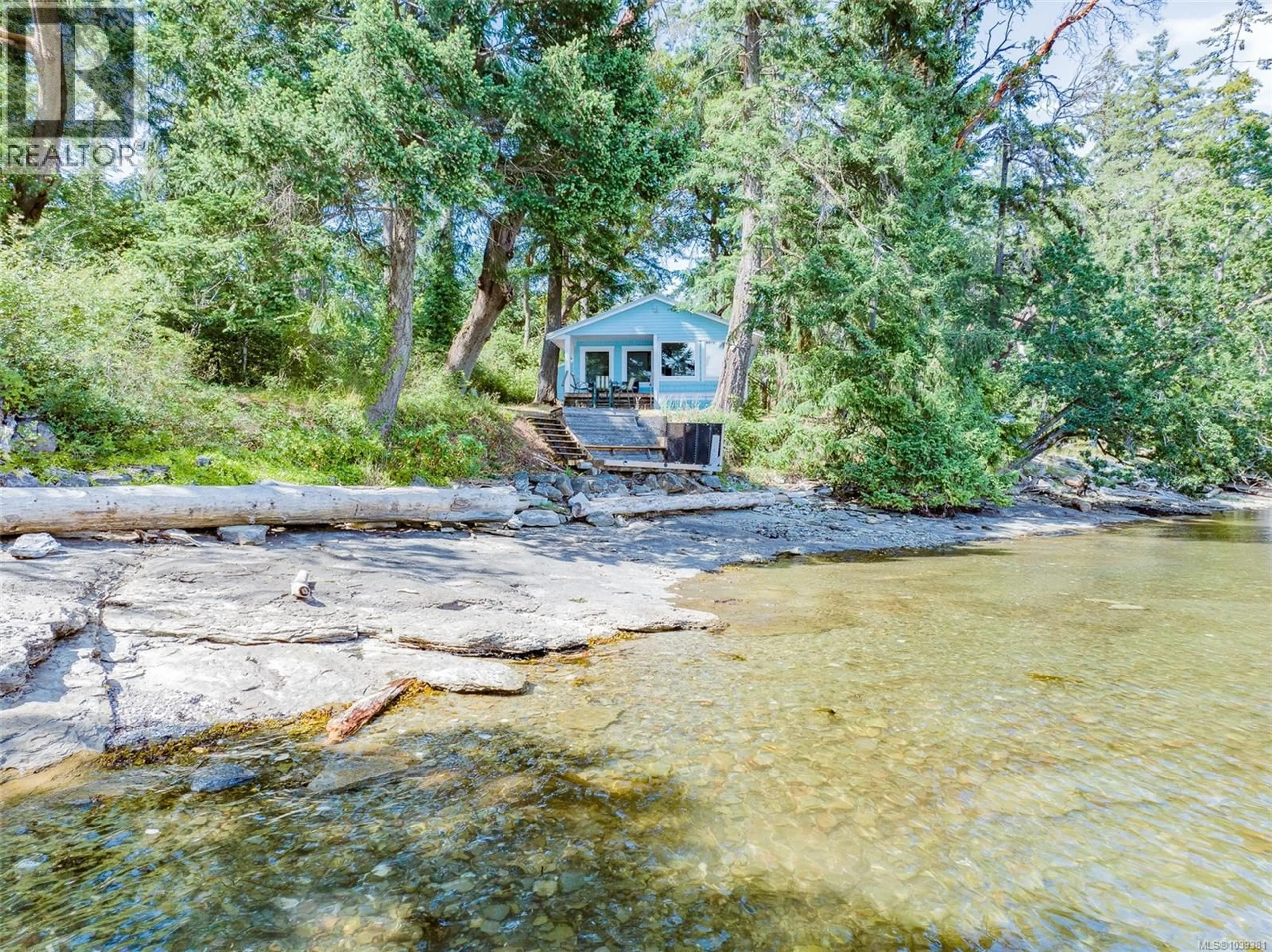A pic from outside/outdoor area/front of a property/back of a property/a pic from drone, water/lake/river/ocean view for 7 PIRATES LANE, Protection Island British Columbia V0R2H0