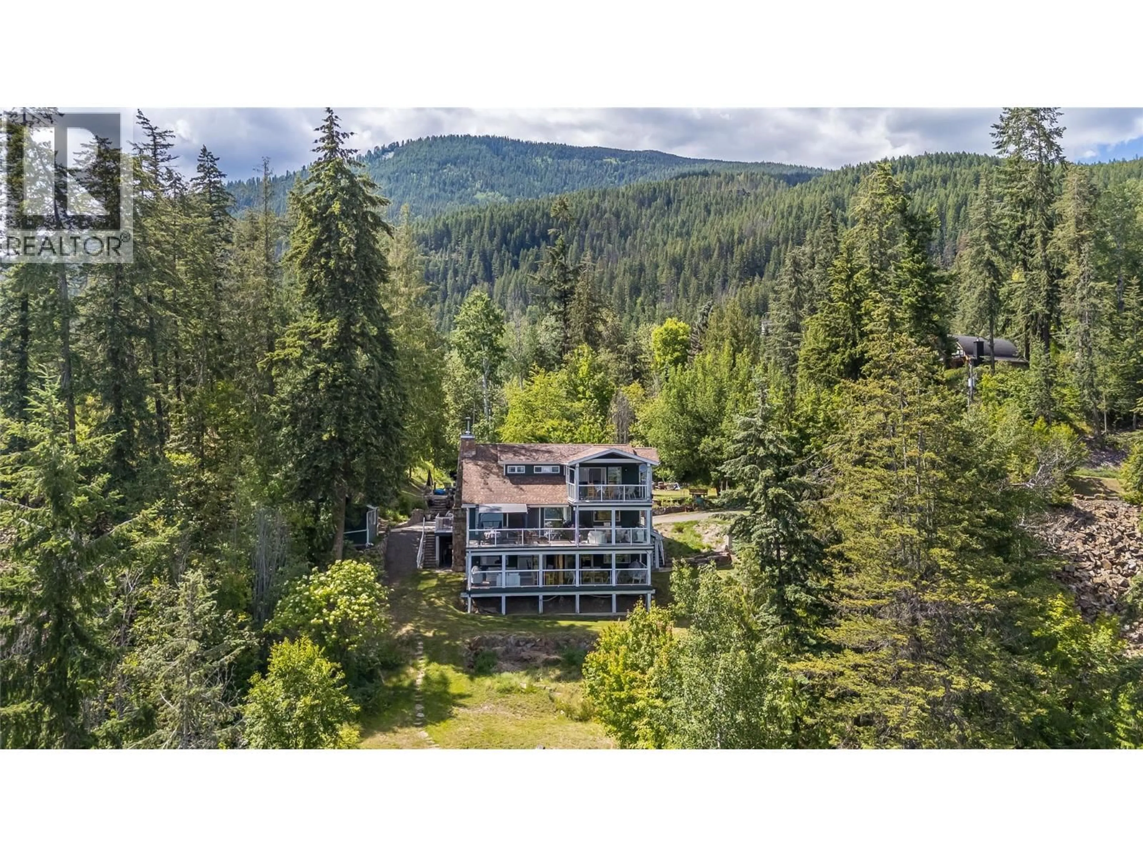 A pic from outside/outdoor area/front of a property/back of a property/a pic from drone, forest/trees view for 464 RAINBOW DRIVE, Kaslo British Columbia V0G1M0