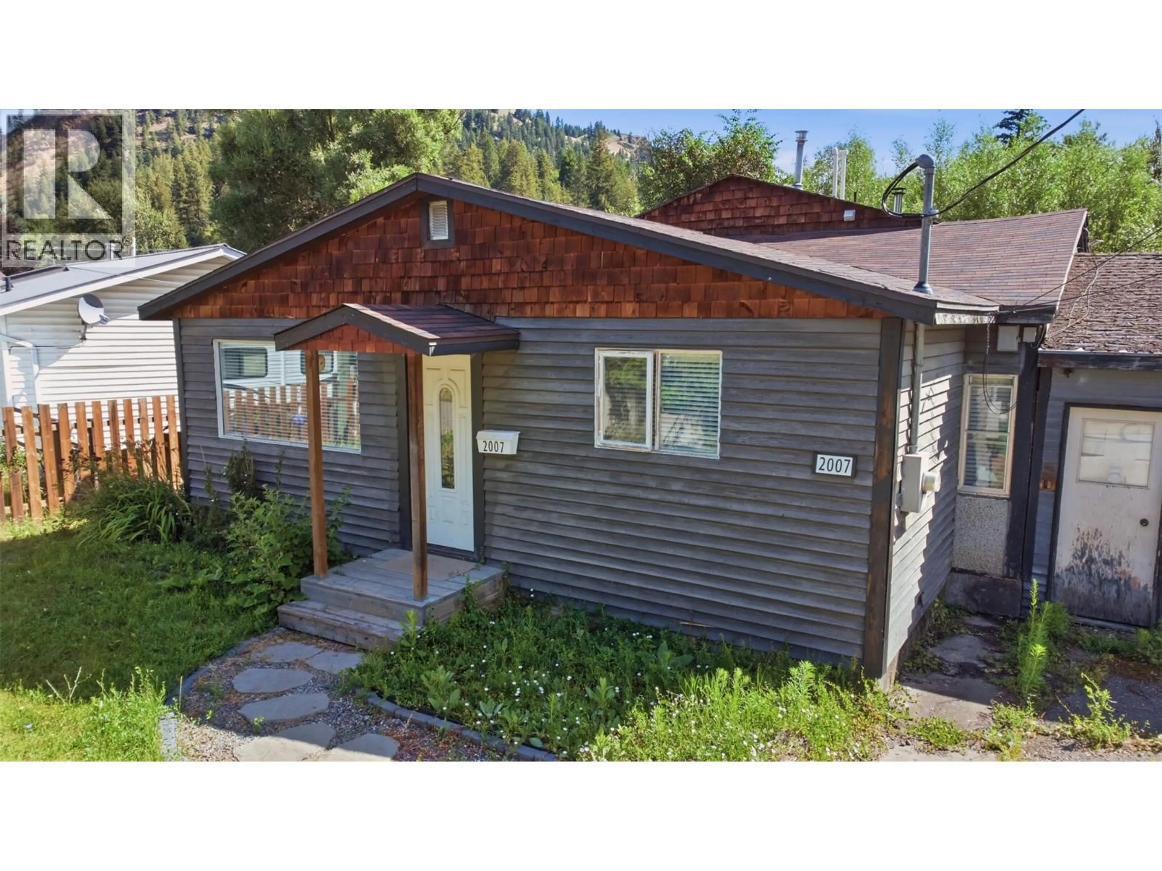 Home with vinyl exterior material, street for 2007 HEIGHWAY CRESCENT, Lumby British Columbia V0E2G0