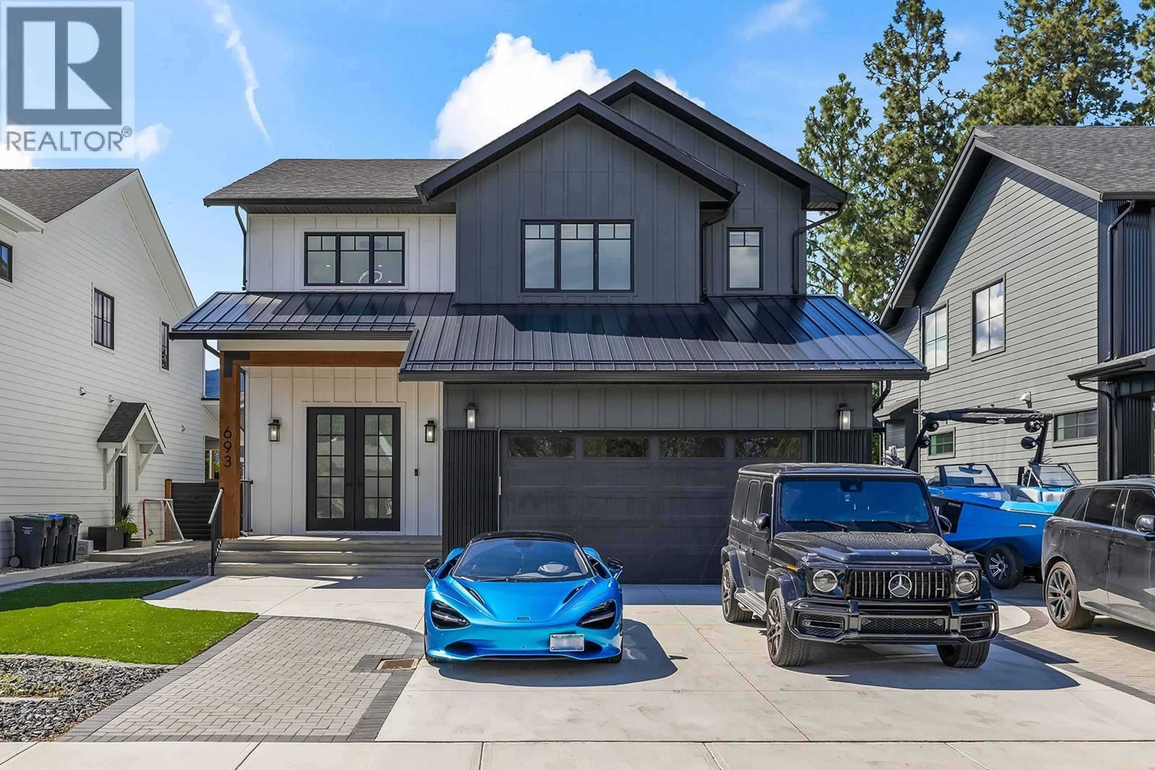 Home with brick exterior material, street for 693 BALSAM ROAD, Kelowna British Columbia V1W1C1