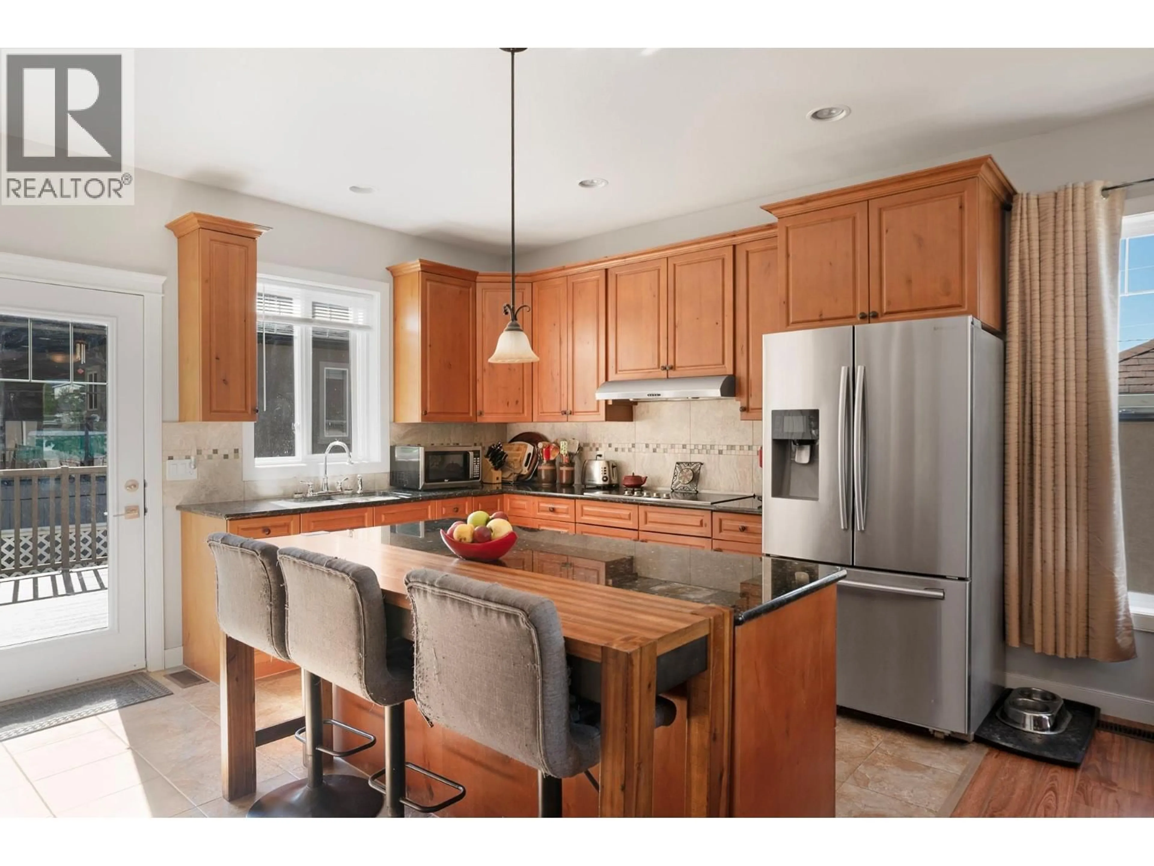 Open concept kitchen, wood/laminate floor for 608 16TH N AVENUE, Creston British Columbia V0B1G5