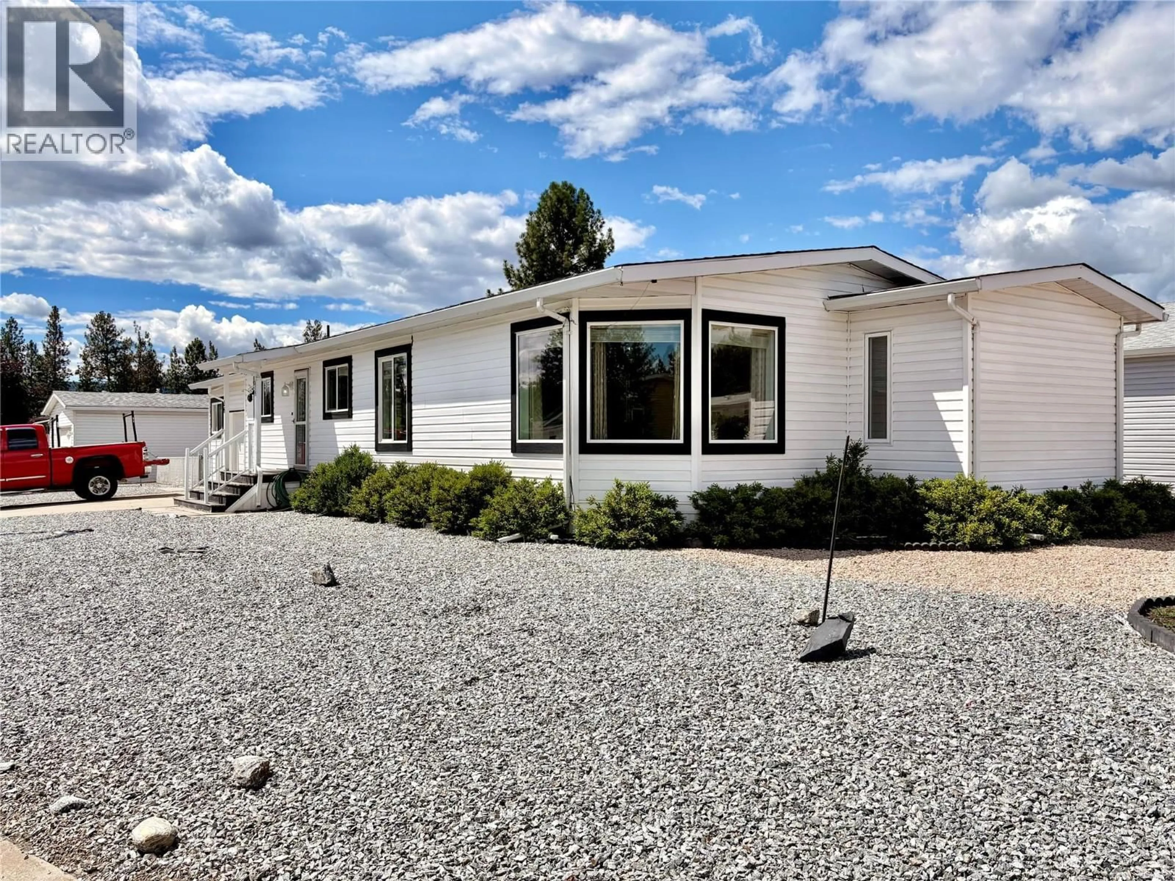 Home with vinyl exterior material, street for 36 - 9510 97 HIGHWAY NORTH, Vernon British Columbia V1H1R8