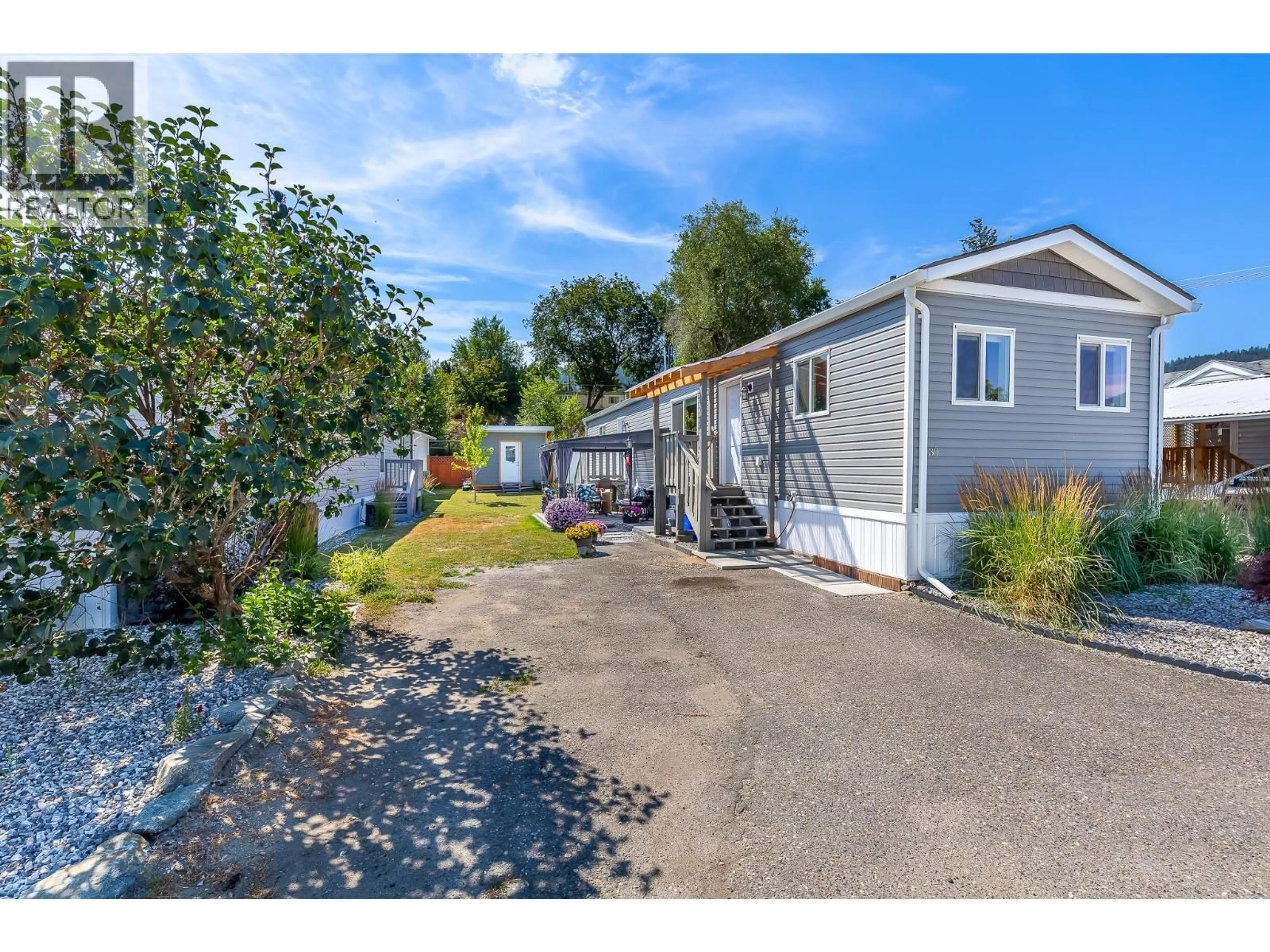 A pic from outside/outdoor area/front of a property/back of a property/a pic from drone, street for 30 - 6902 OKANAGAN LANDING ROAD, Vernon British Columbia V1H1X4