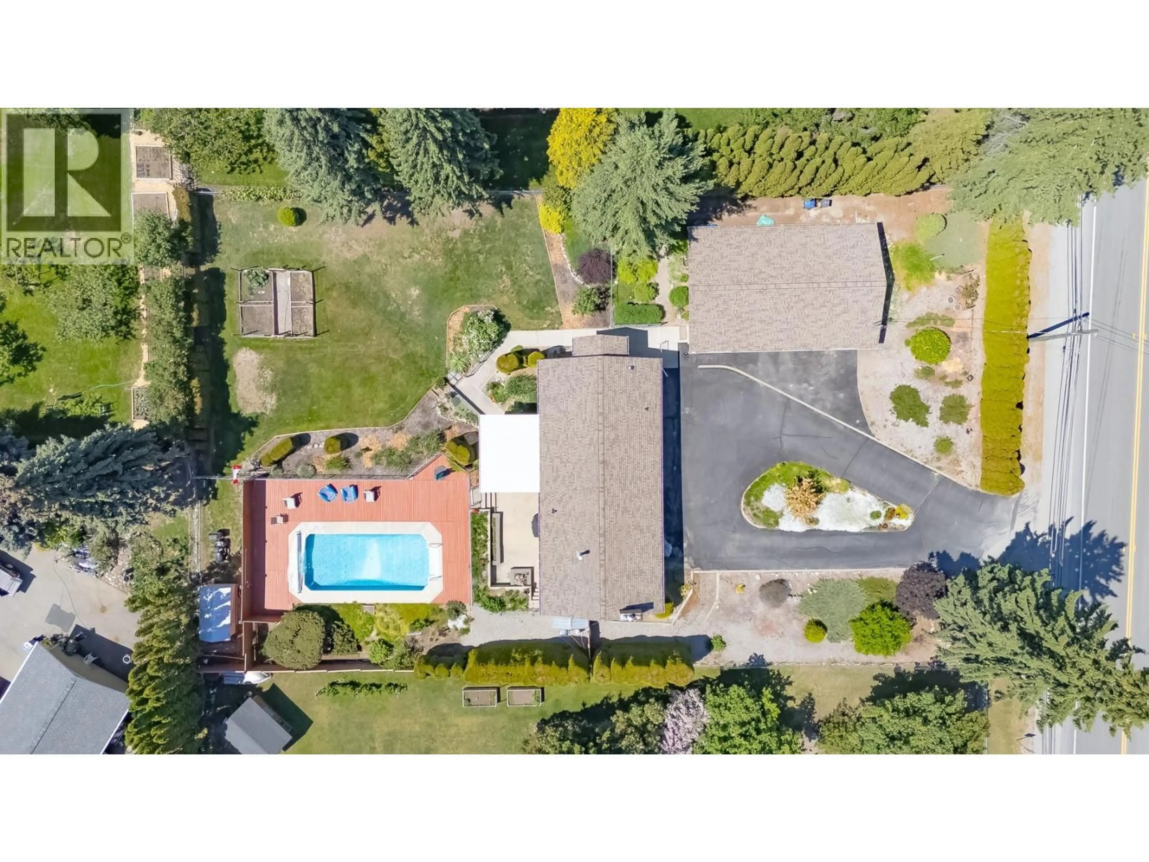 A pic from outside/outdoor area/front of a property/back of a property/a pic from drone, street for 709 BARTLETT DRIVE, Penticton British Columbia V2A7K8