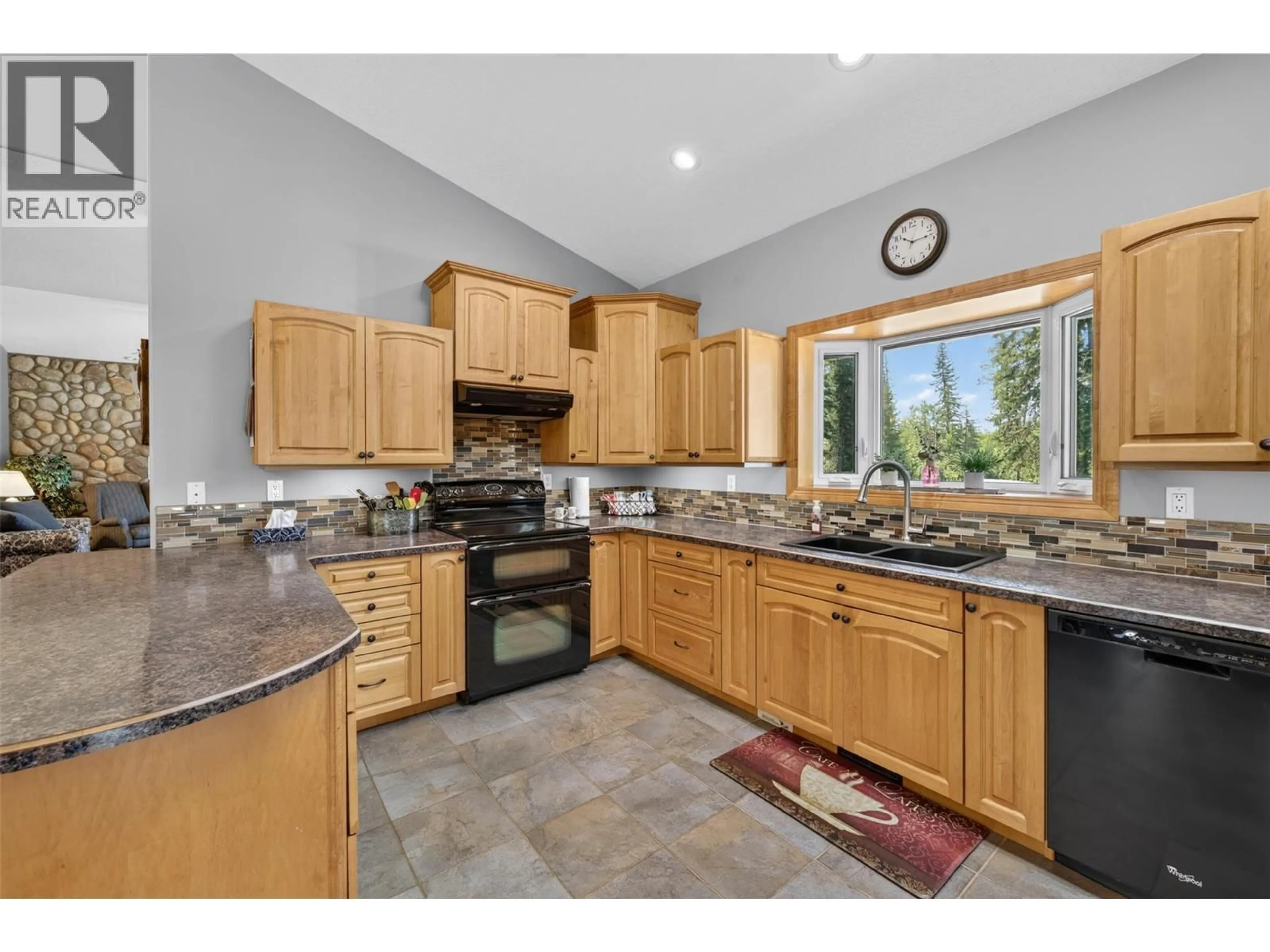 Open concept kitchen, ceramic/tile floor for 5242 LEBELL ROAD, Dawson Creek British Columbia V1G0J4