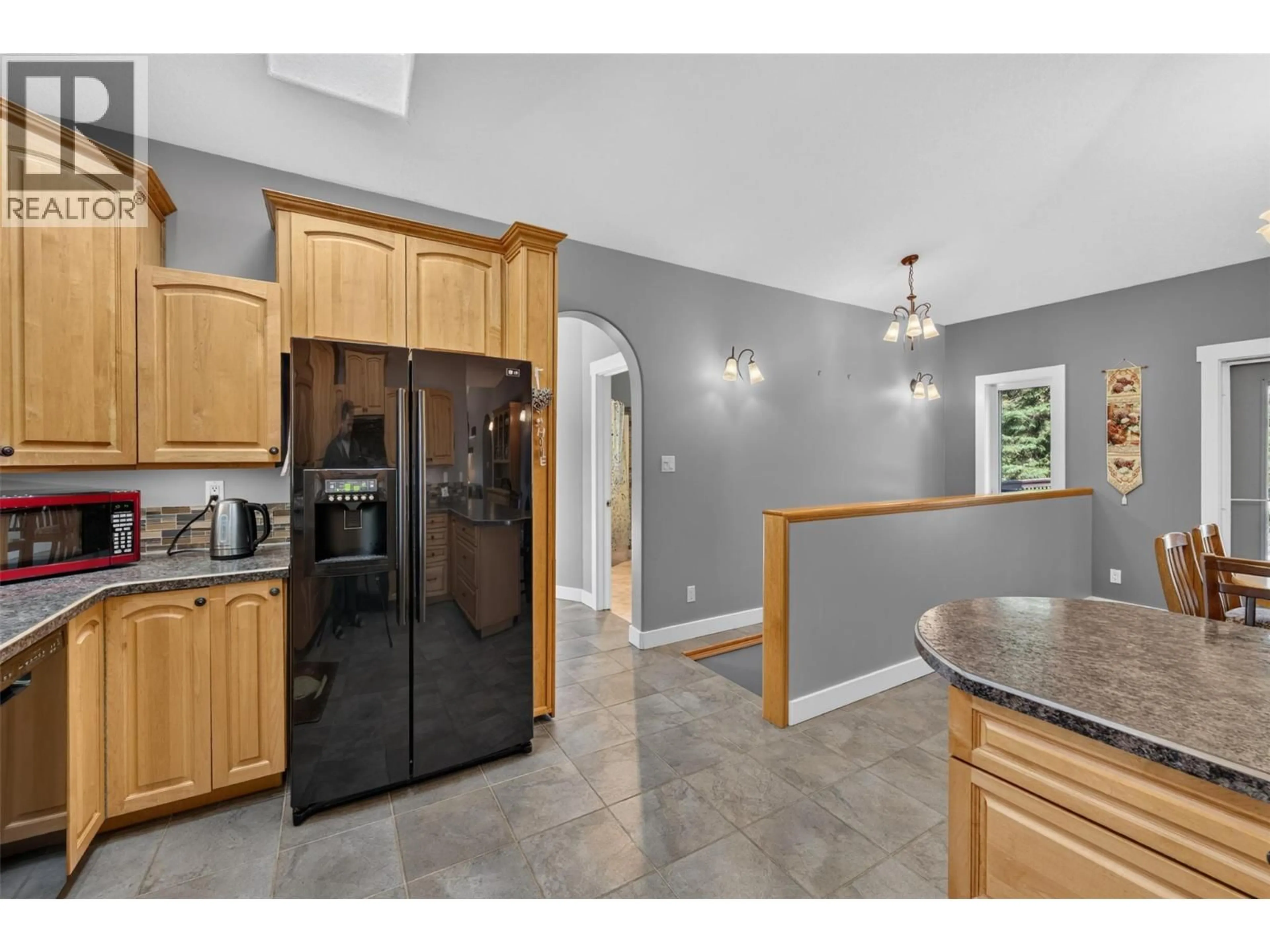 Open concept kitchen, ceramic/tile floor for 5242 LEBELL ROAD, Dawson Creek British Columbia V1G0J4