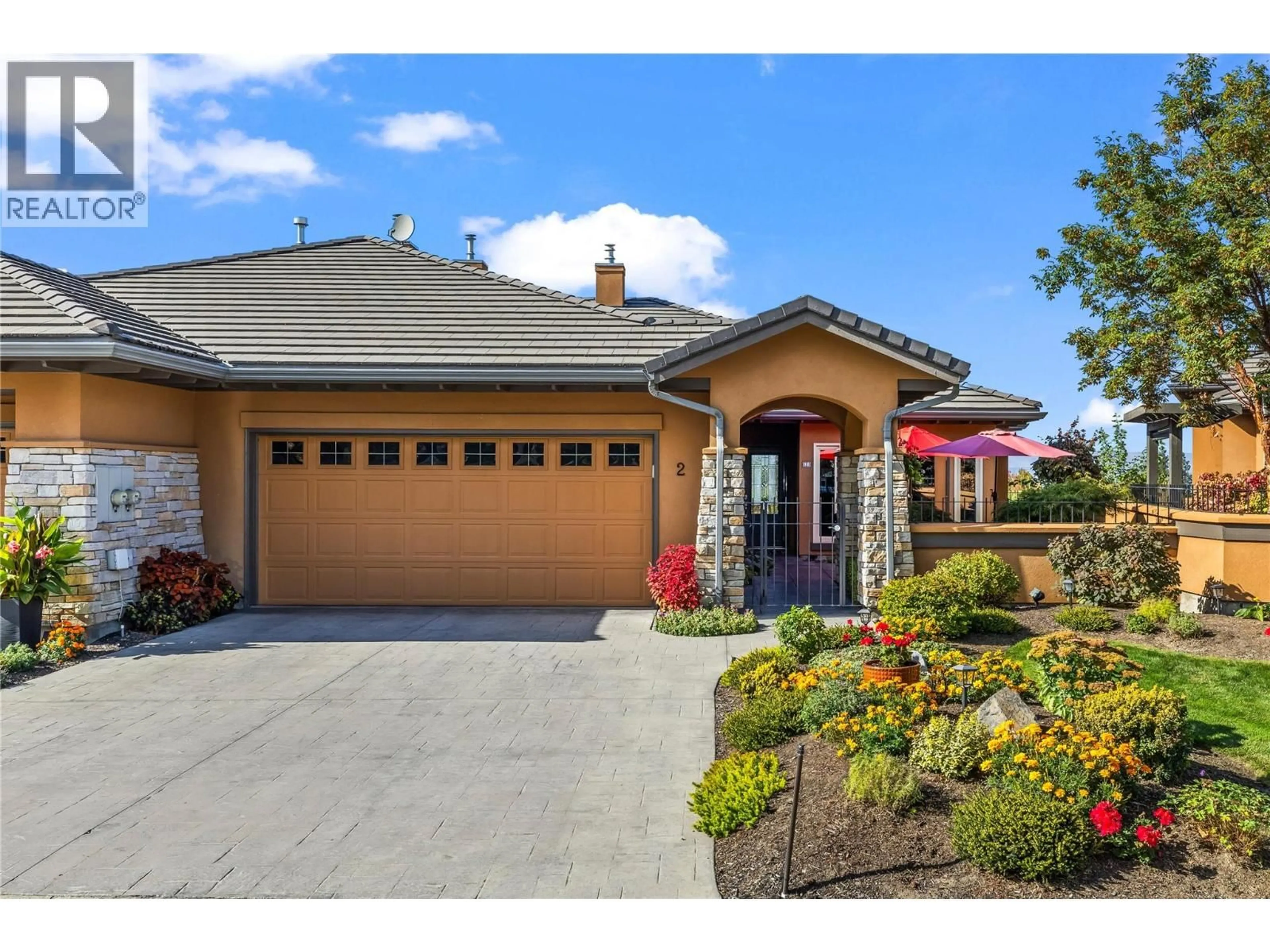 Home with brick exterior material, street for 2 - 4100 GALLAGHERS PARKLAND, Kelowna British Columbia V1W3Z8