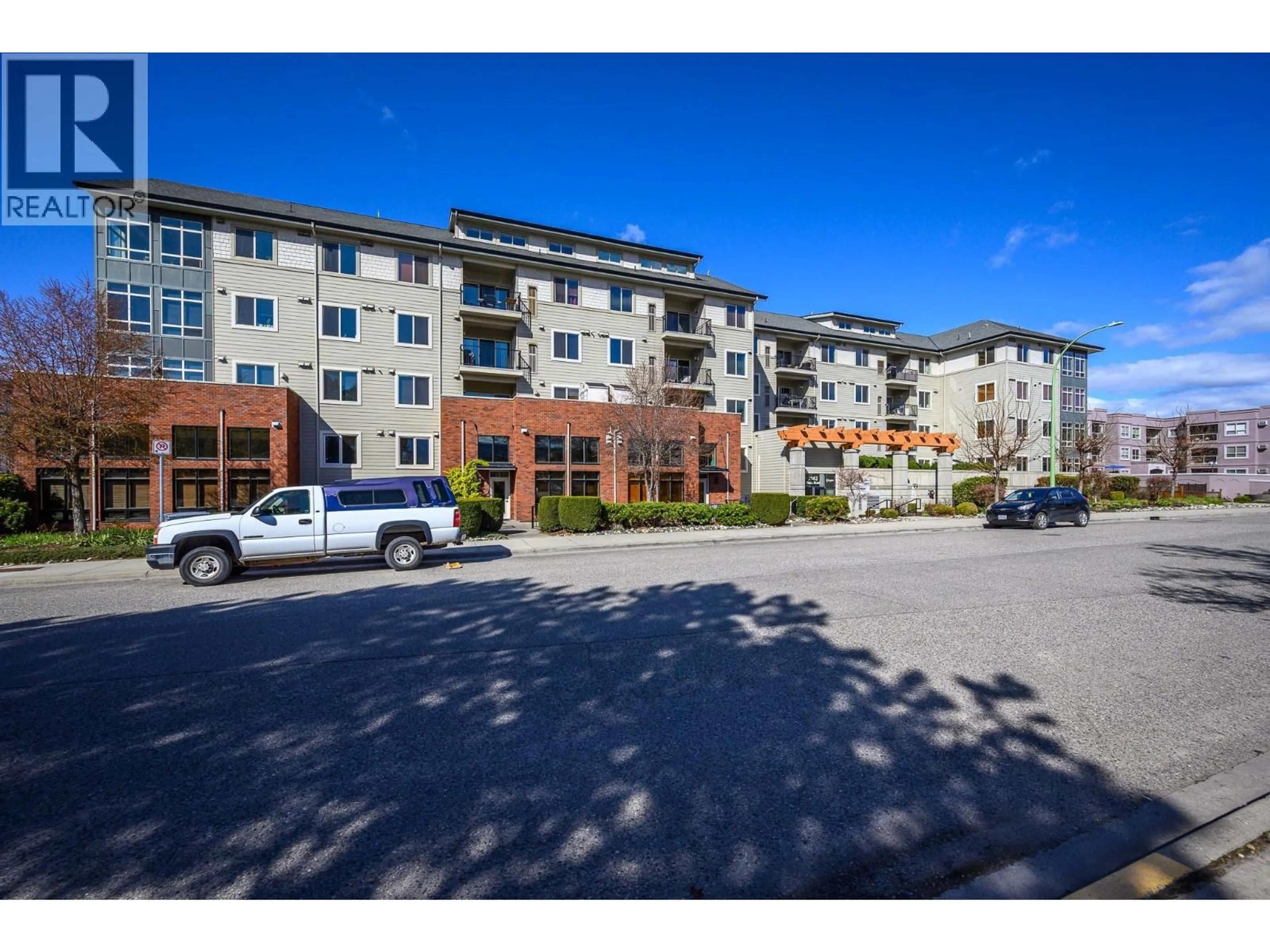 A pic from outside/outdoor area/front of a property/back of a property/a pic from drone, unknown for 211 - 2142 VASILE ROAD, Kelowna British Columbia V1Y6H5