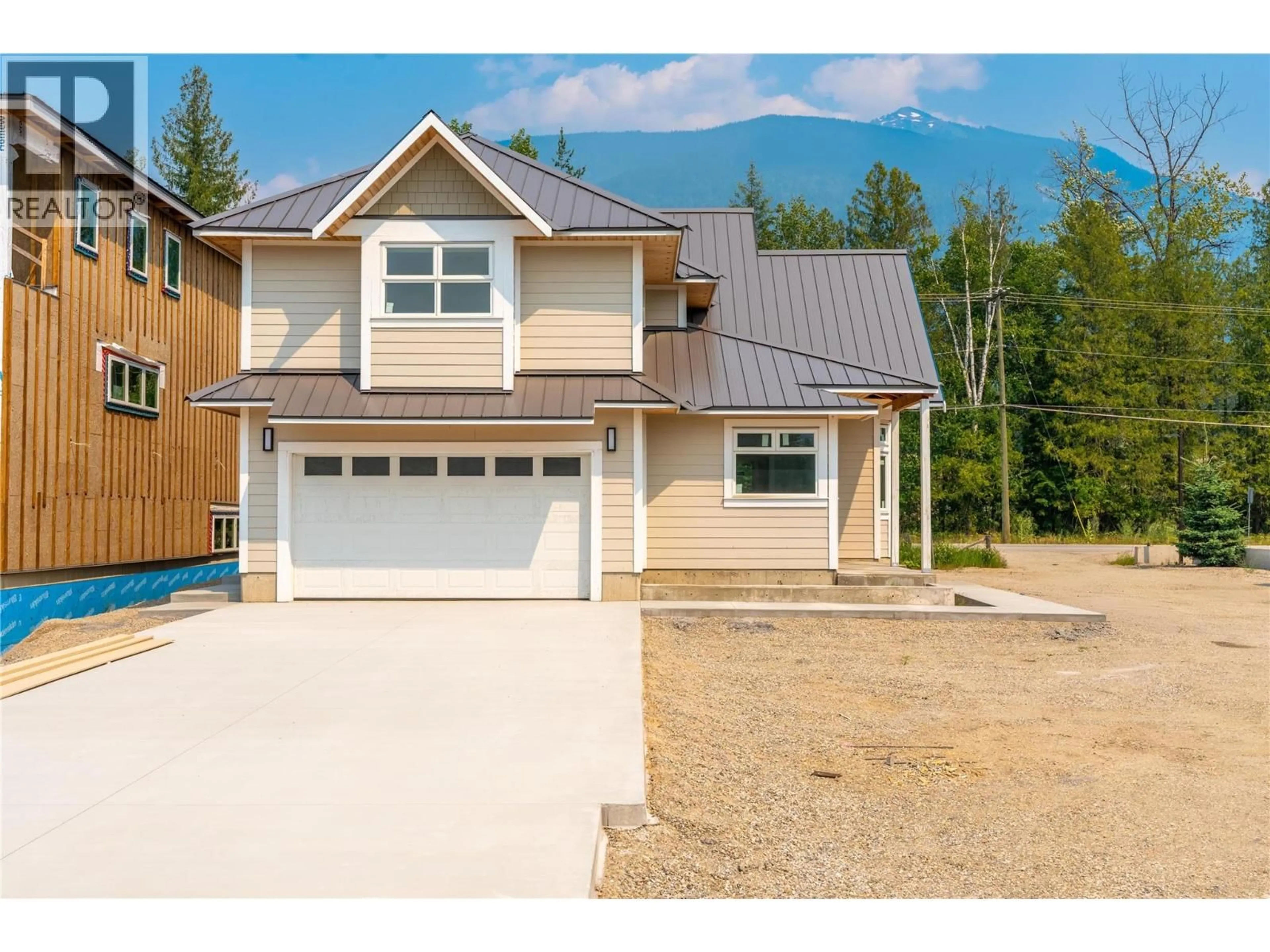 Home with vinyl exterior material, street for 2014 LANZO LANE, Revelstoke British Columbia V0E2S1