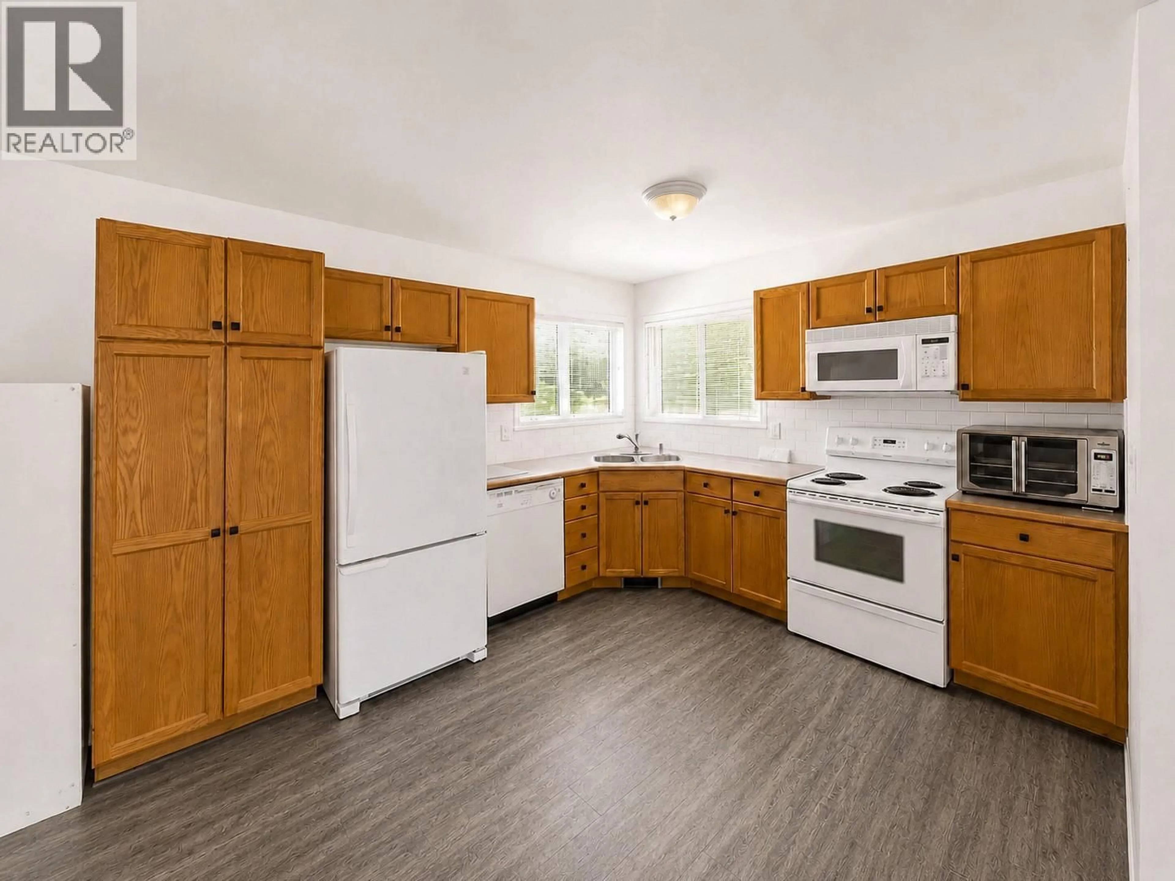 Standard kitchen, wood/laminate floor for 5031 RIVERVIEW ROAD, Fairmont Hot Springs British Columbia V0B1L1