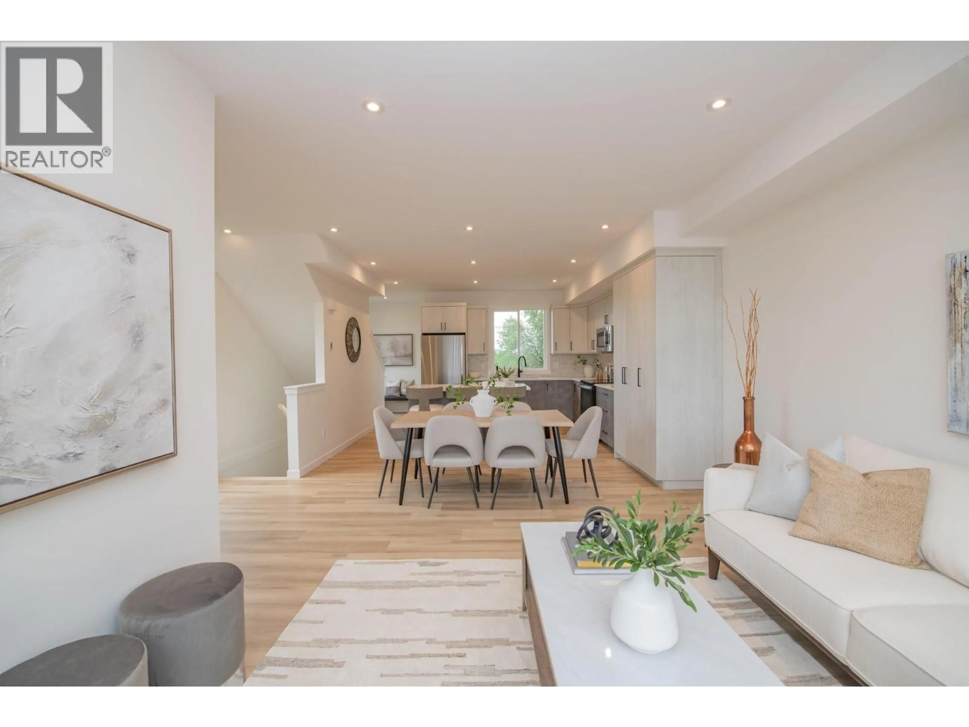 Open concept kitchen, wood/laminate floor for 1 - 3602 PLEASANT VALLEY ROAD, Vernon British Columbia V1T4L6