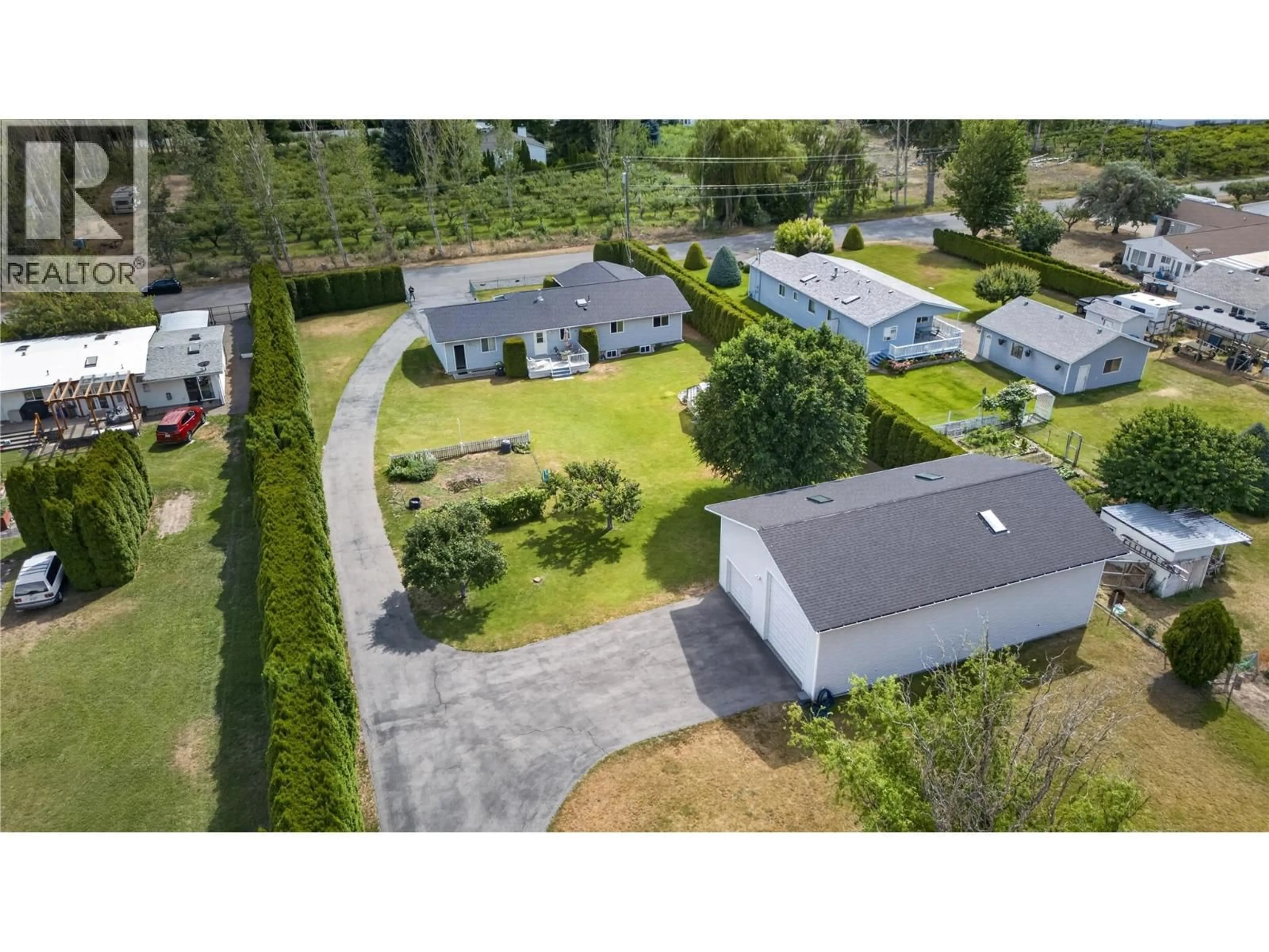 A pic from outside/outdoor area/front of a property/back of a property/a pic from drone, street for 3006 ORCHARD DRIVE, Keremeos British Columbia V0X1N1