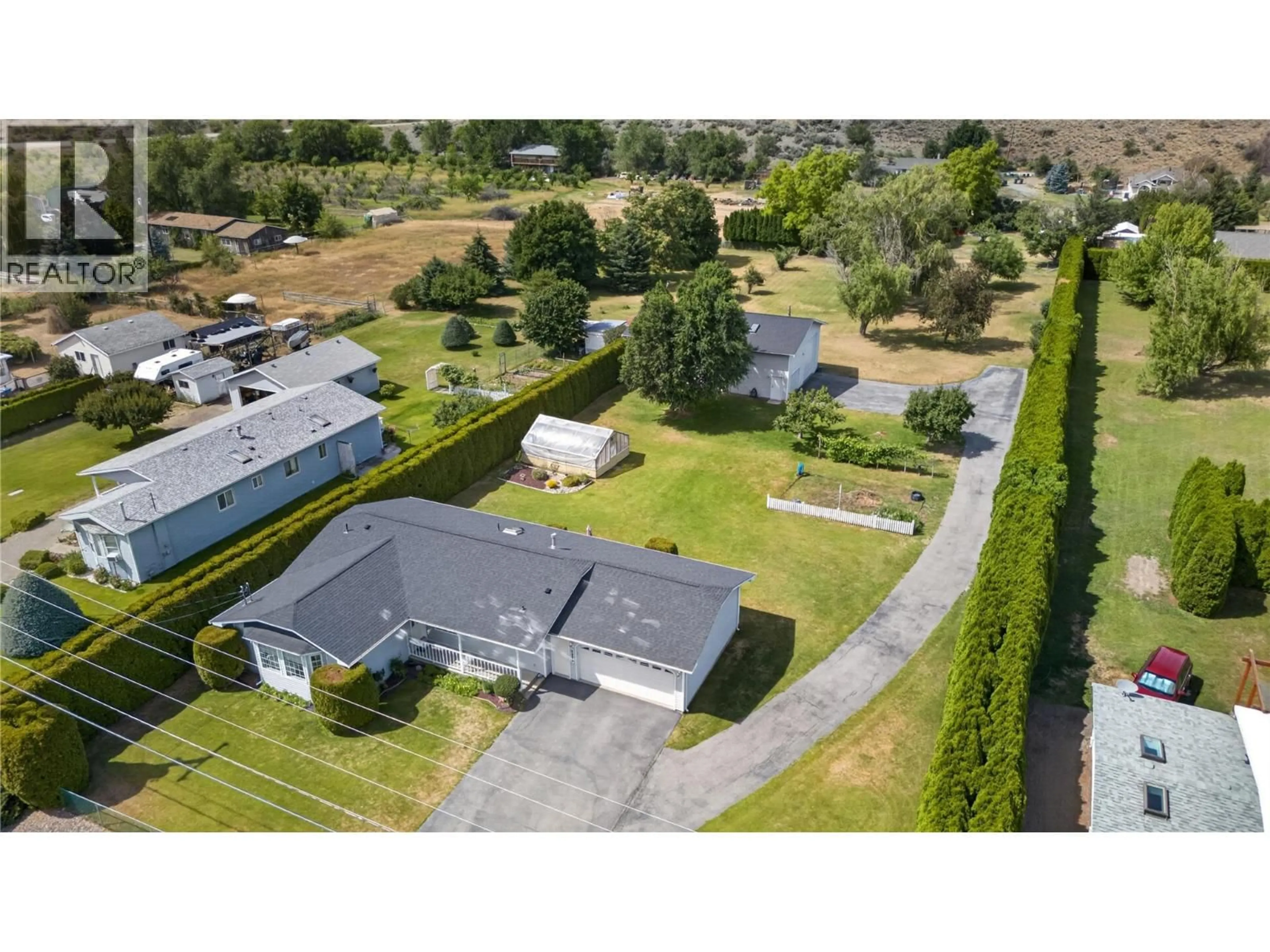 A pic from outside/outdoor area/front of a property/back of a property/a pic from drone, street for 3006 ORCHARD DRIVE, Keremeos British Columbia V0X1N1