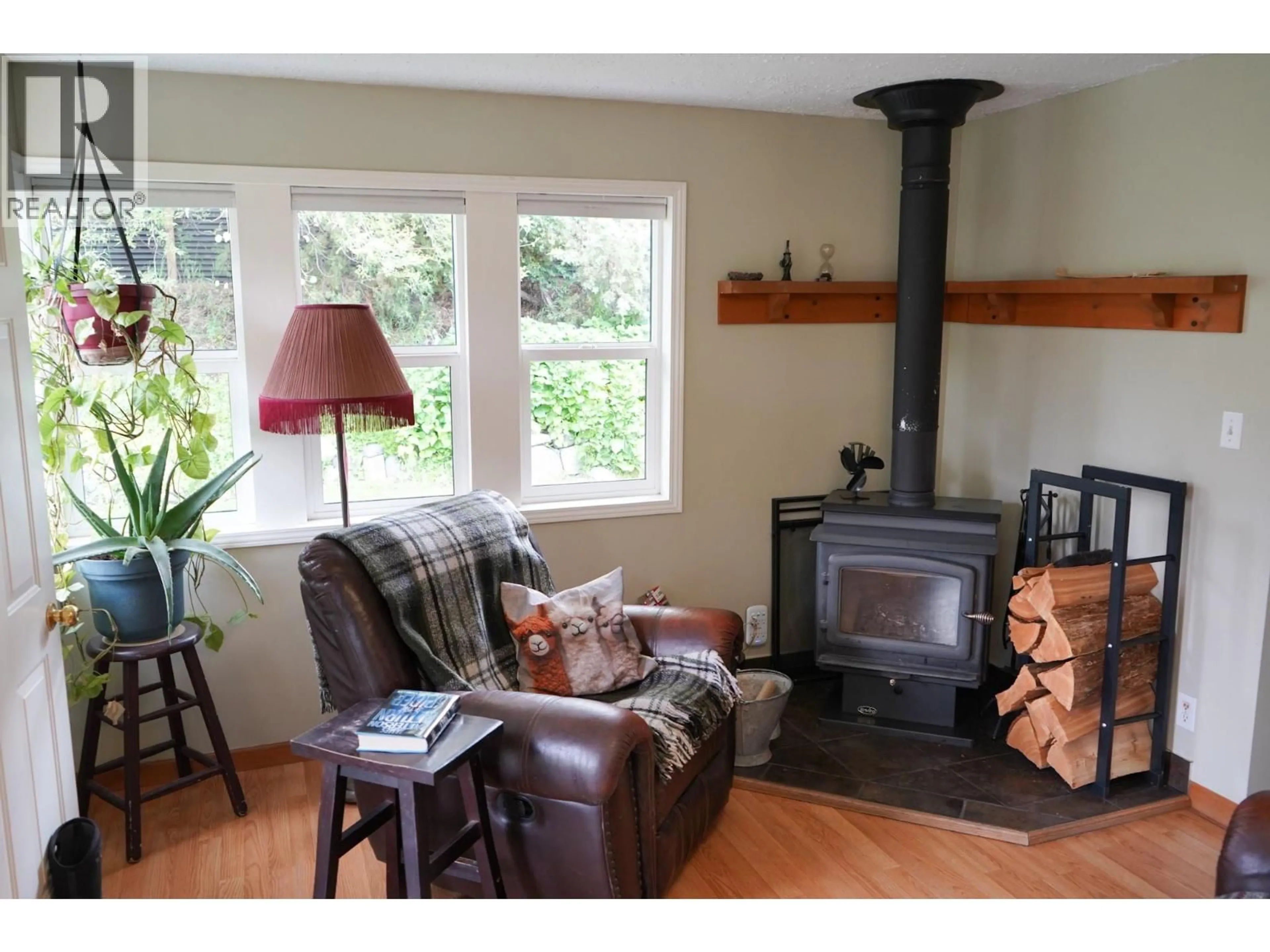 Living room with furniture, wood/laminate floor for 304 MCDONALD AVENUE, Clinton British Columbia V0K1K0