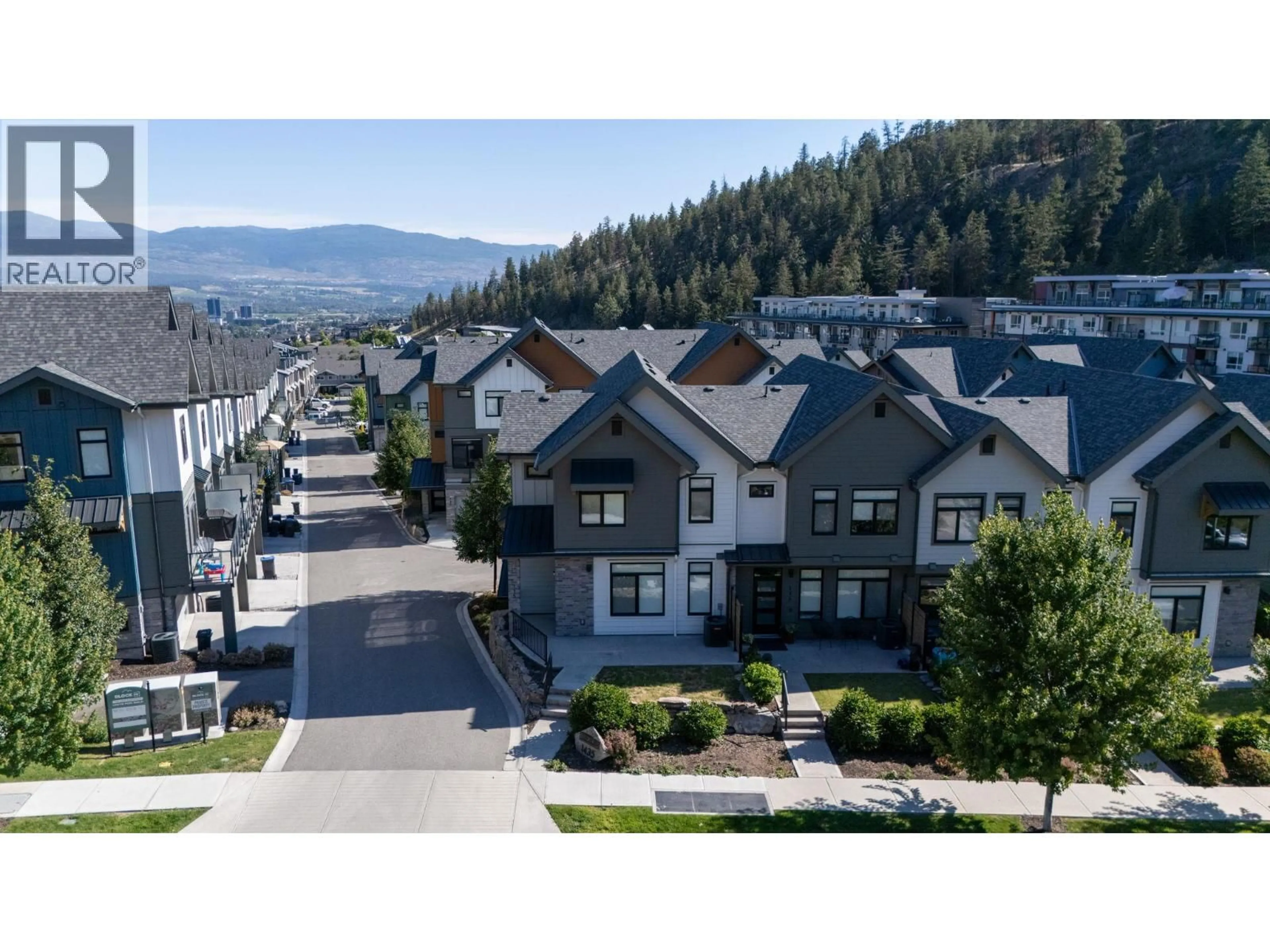 A pic from outside/outdoor area/front of a property/back of a property/a pic from drone, mountain view for 115 - 1435 CARA GLEN COURT, Kelowna British Columbia V1V0G1