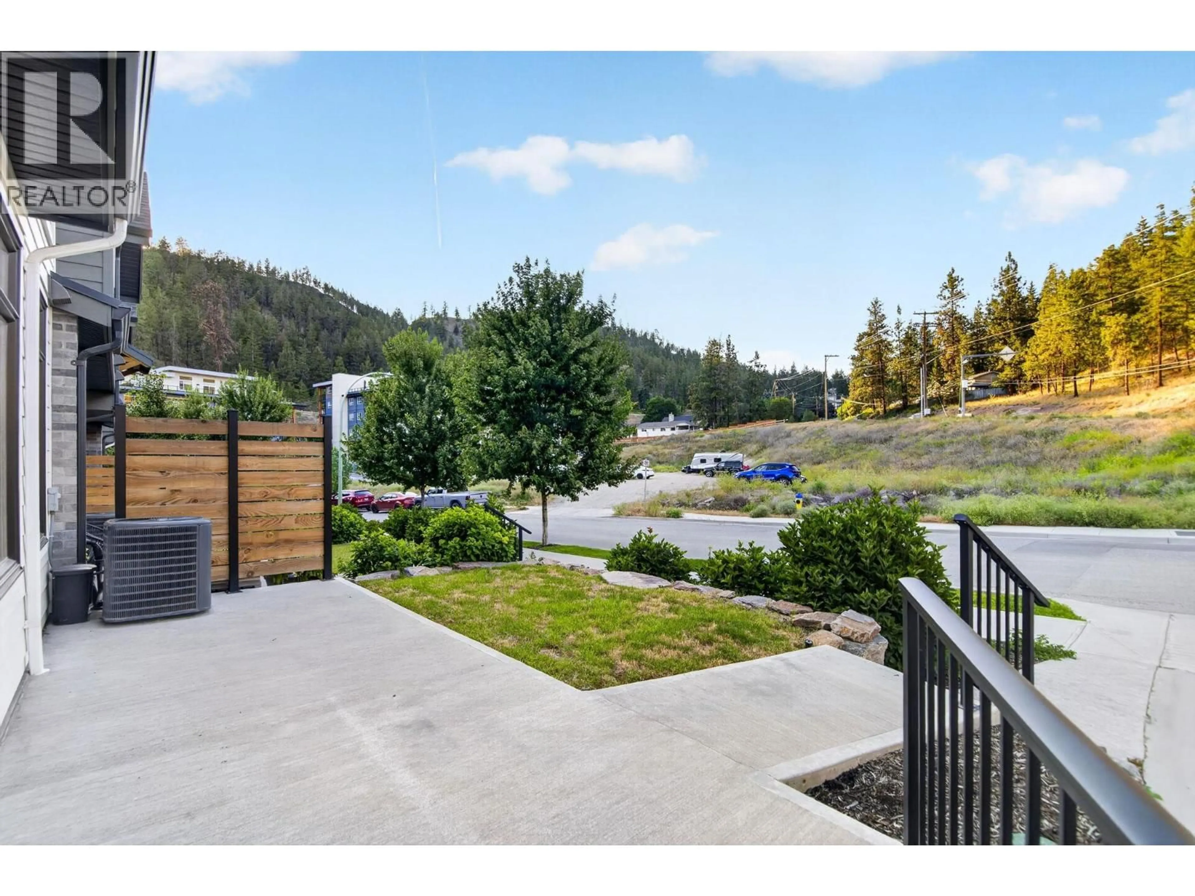A pic from outside/outdoor area/front of a property/back of a property/a pic from drone, mountain view for 115 - 1435 CARA GLEN COURT, Kelowna British Columbia V1V0G1