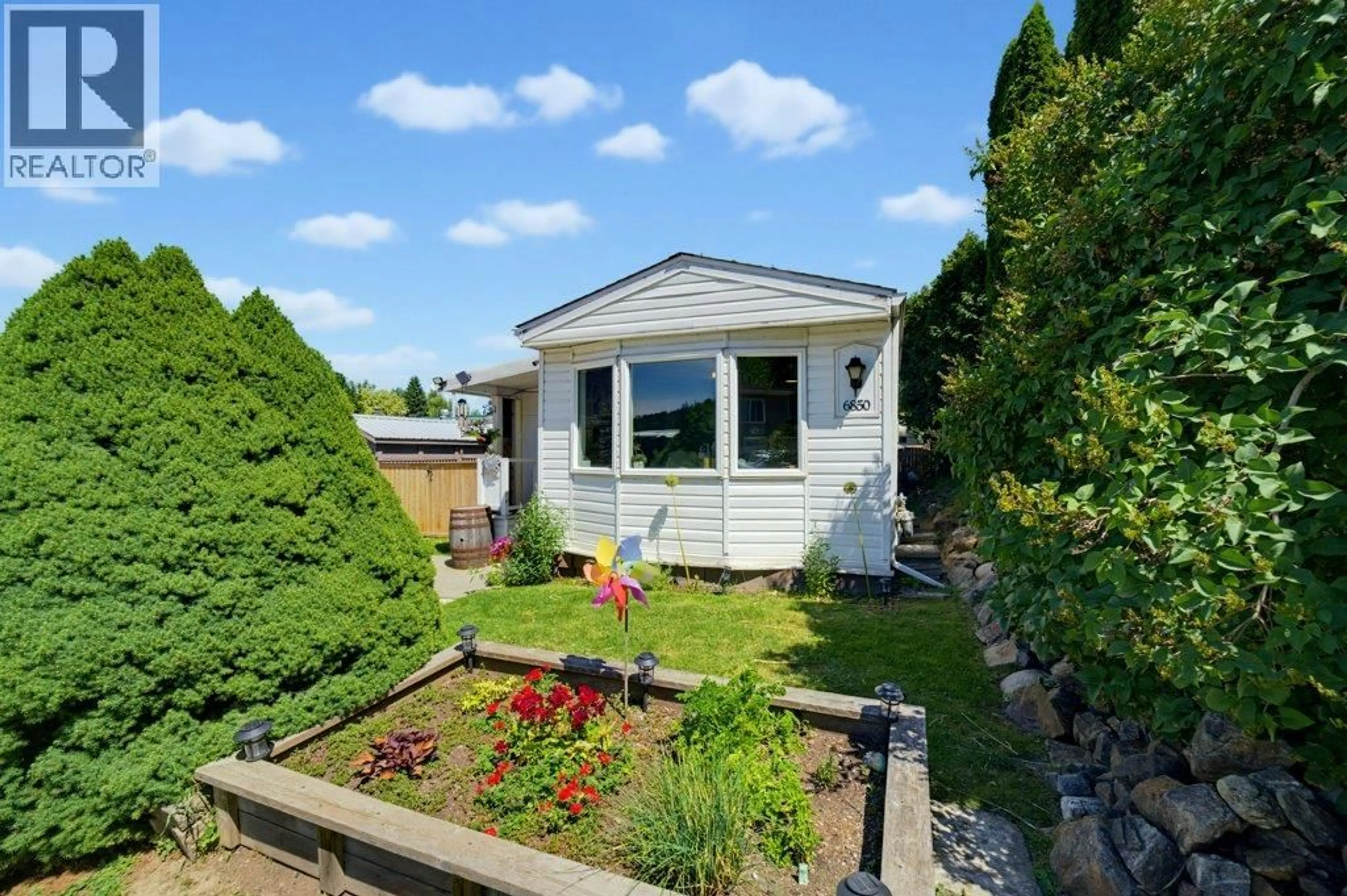 A pic from outside/outdoor area/front of a property/back of a property/a pic from drone, street for 6850 53 STREET NORTHEAST, Salmon Arm British Columbia V0E1K0