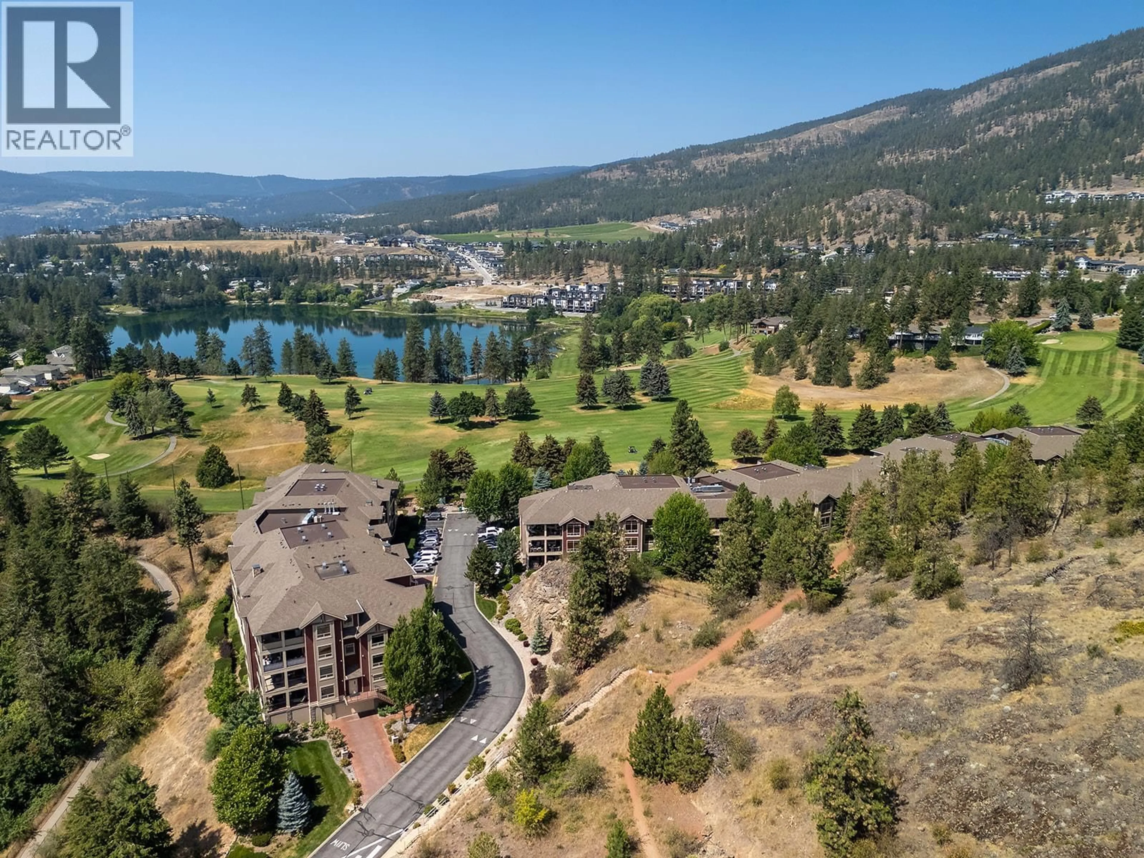 A pic from outside/outdoor area/front of a property/back of a property/a pic from drone, water/lake/river/ocean view for 112 - 2770 AUBURN ROAD, West Kelowna British Columbia V4T4C2