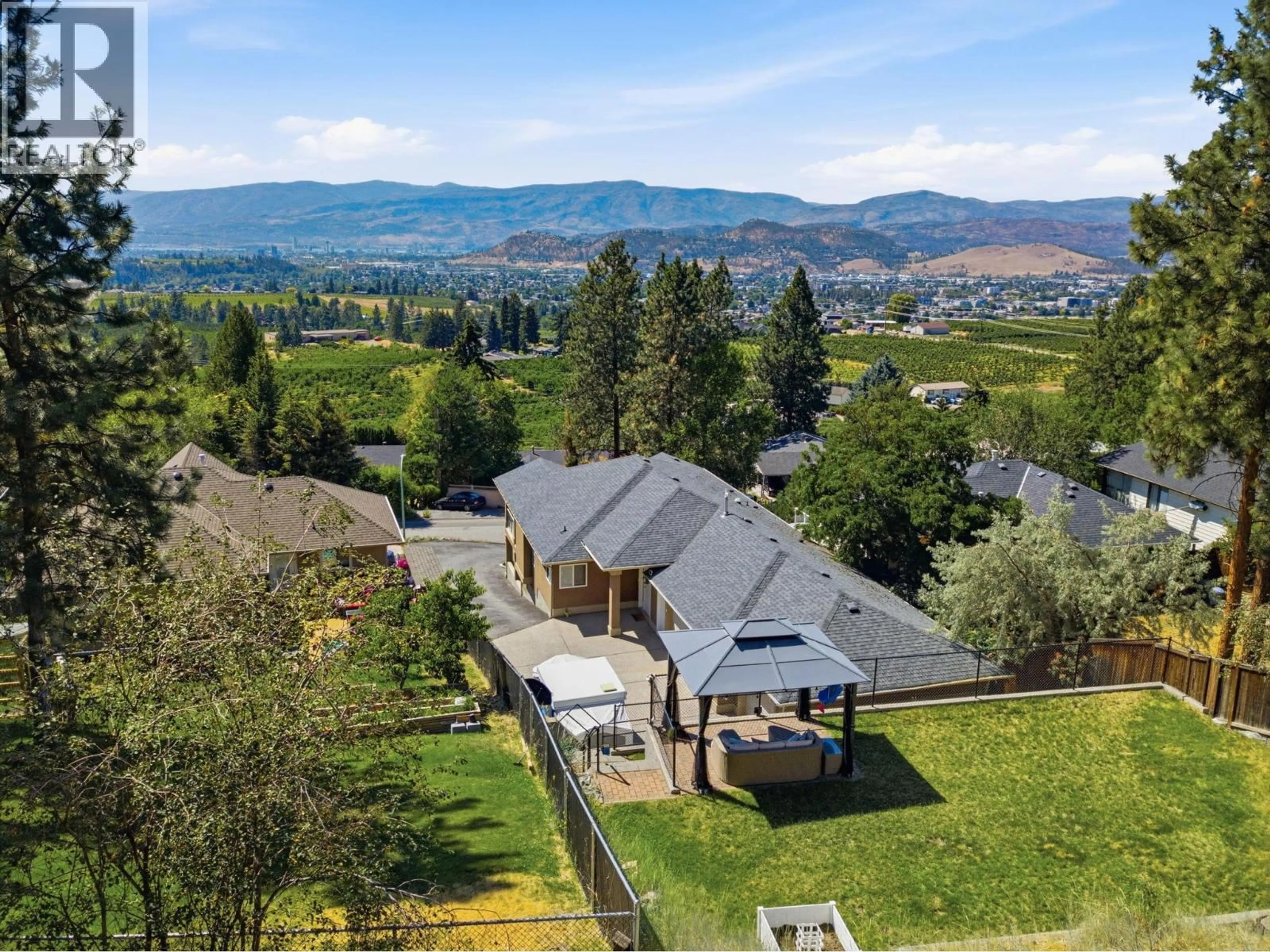 A pic from outside/outdoor area/front of a property/back of a property/a pic from drone, mountain view for 1115 BENTIEN ROAD, Kelowna British Columbia V1X6R9