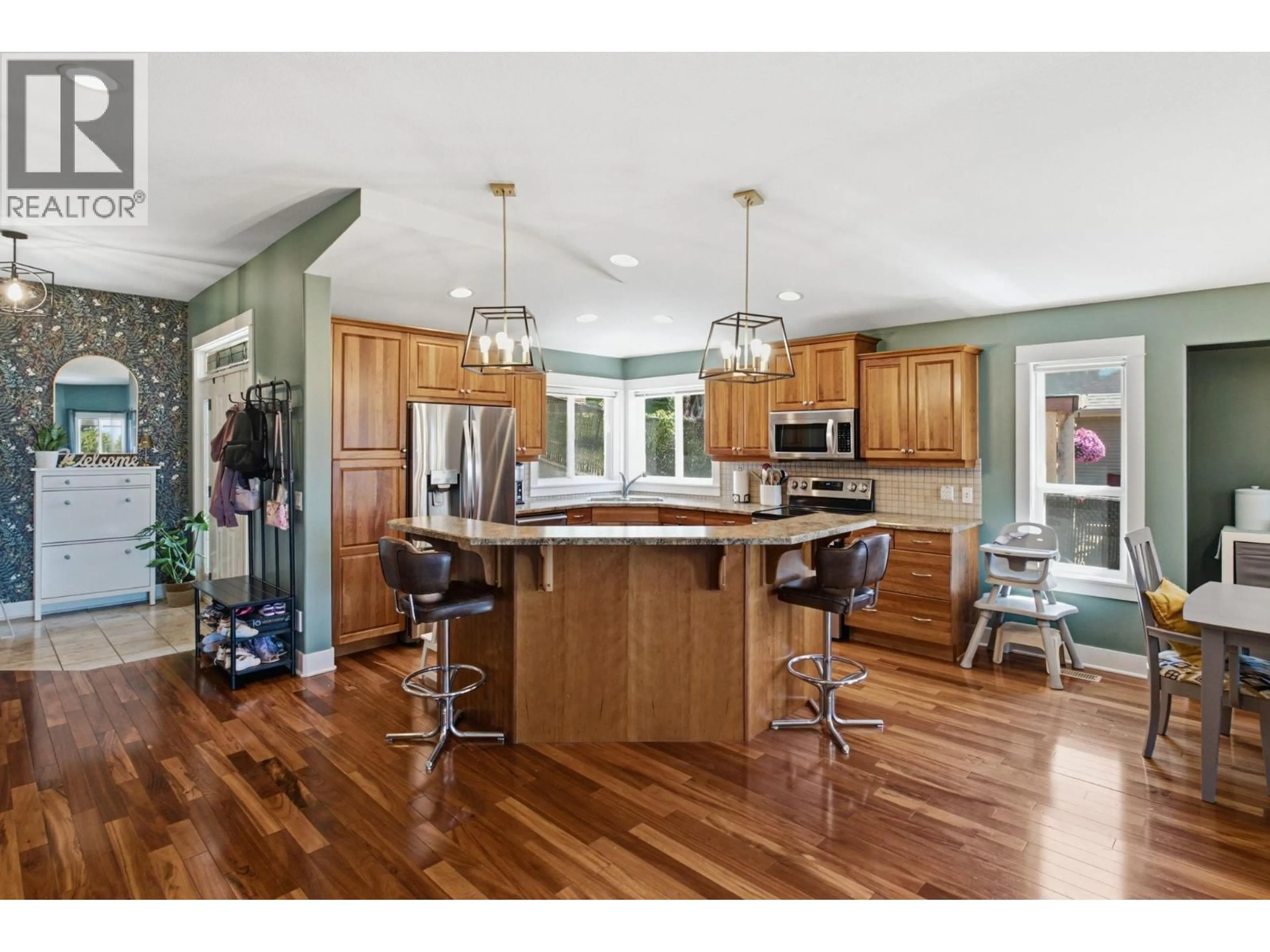 Open concept kitchen, wood/laminate floor for 1115 BENTIEN ROAD, Kelowna British Columbia V1X6R9