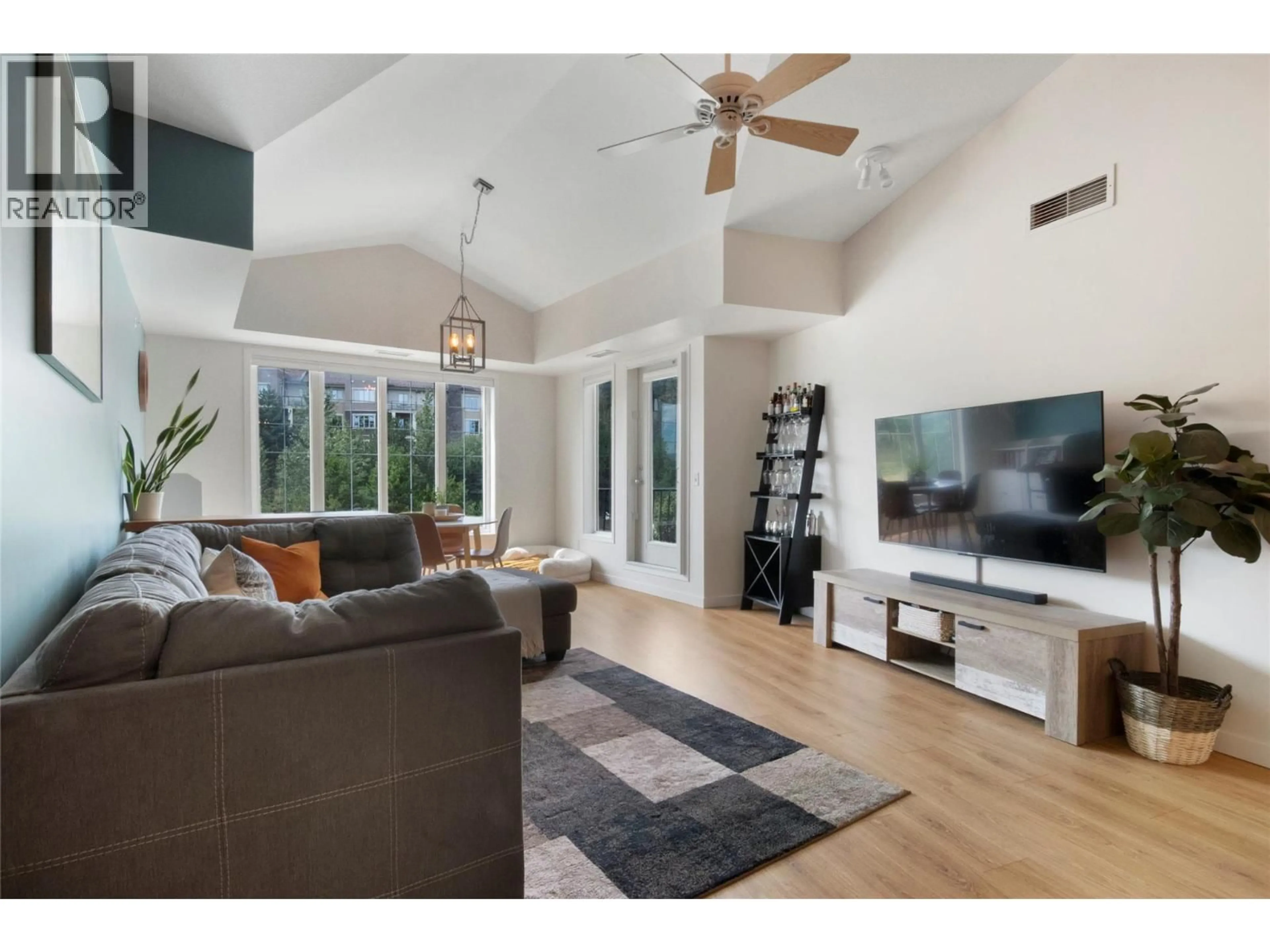 Living room with furniture, wood/laminate floor for 2403 - 3178 VIA CENTRALE ROAD, Kelowna British Columbia V1V2T3