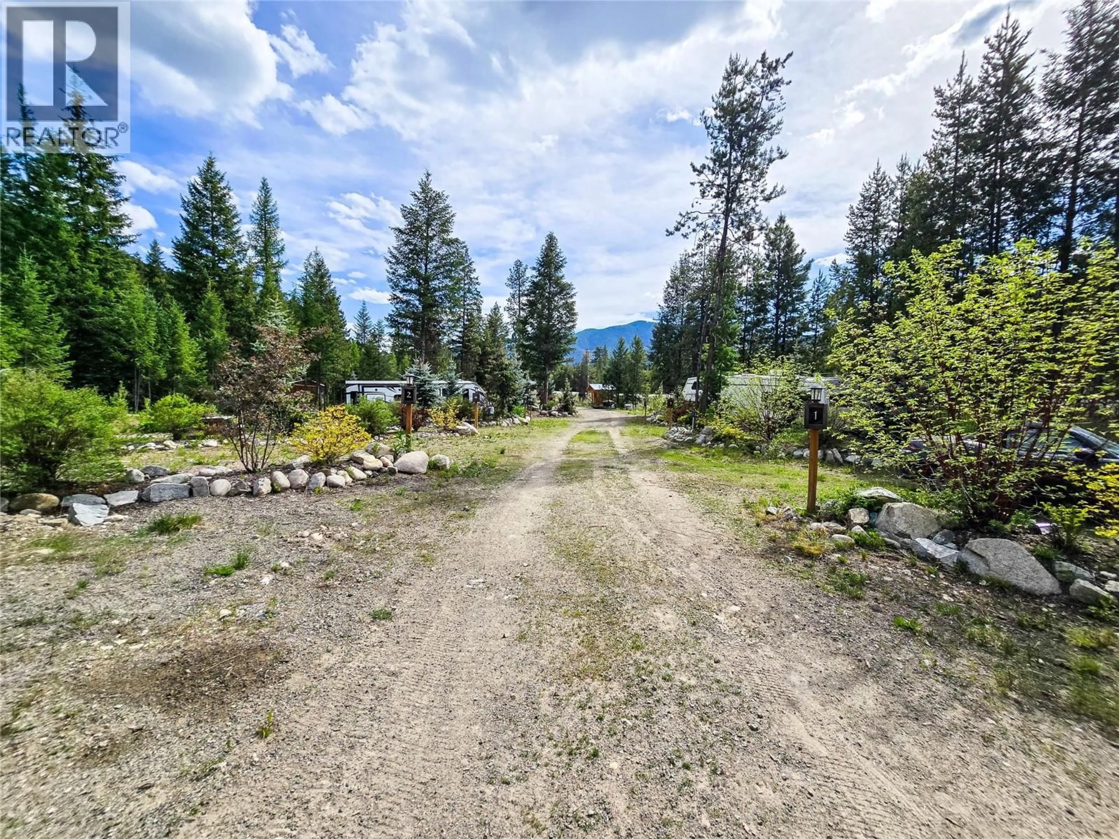 A pic from outside/outdoor area/front of a property/back of a property/a pic from drone, forest/trees view for 5550 HIGHWAY 33 HIGHWAY, Beaverdell British Columbia V0H1A0