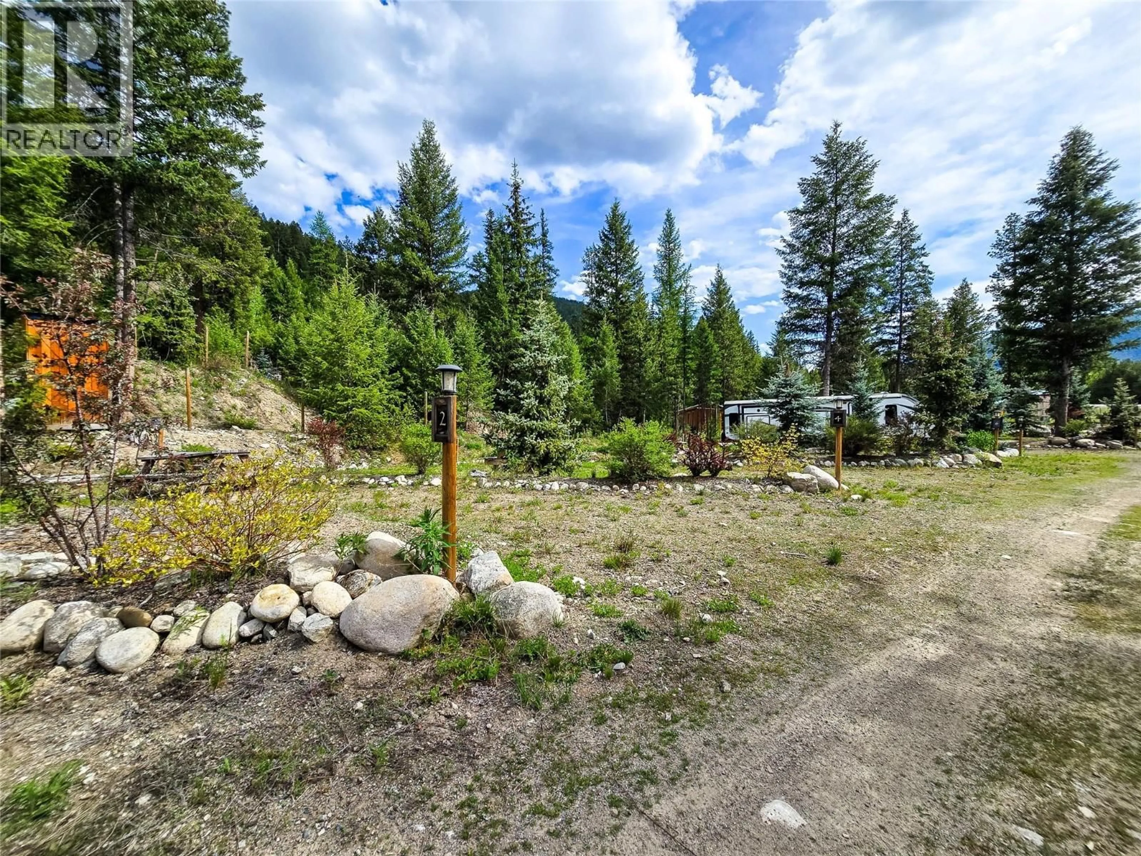 A pic from outside/outdoor area/front of a property/back of a property/a pic from drone, forest/trees view for 5550 HIGHWAY 33 HIGHWAY, Beaverdell British Columbia V0H1A0