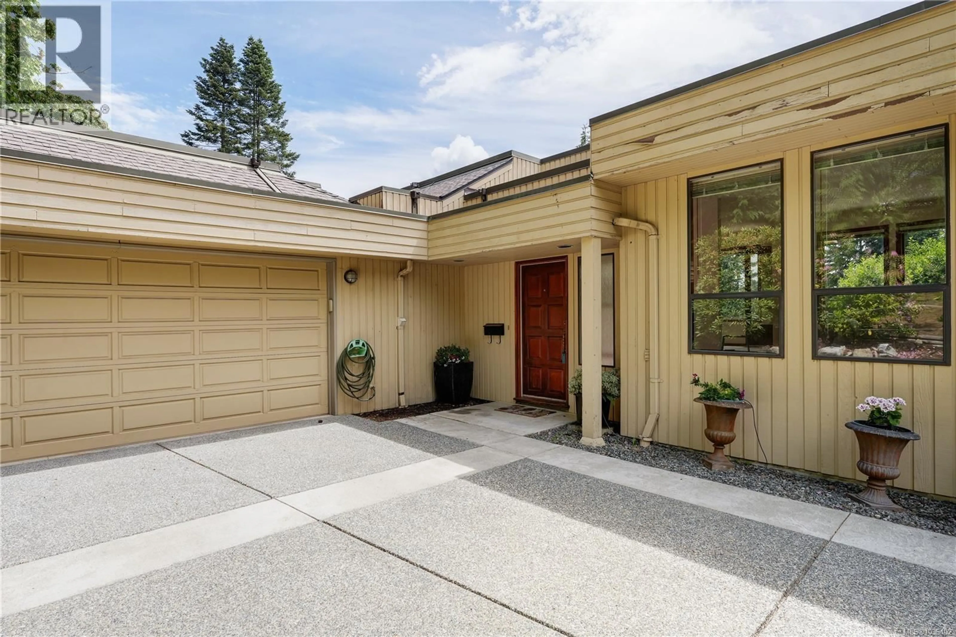 Home with brick exterior material, street for 8587 SANSUM PARK DRIVE, North Saanich British Columbia V8L4V4