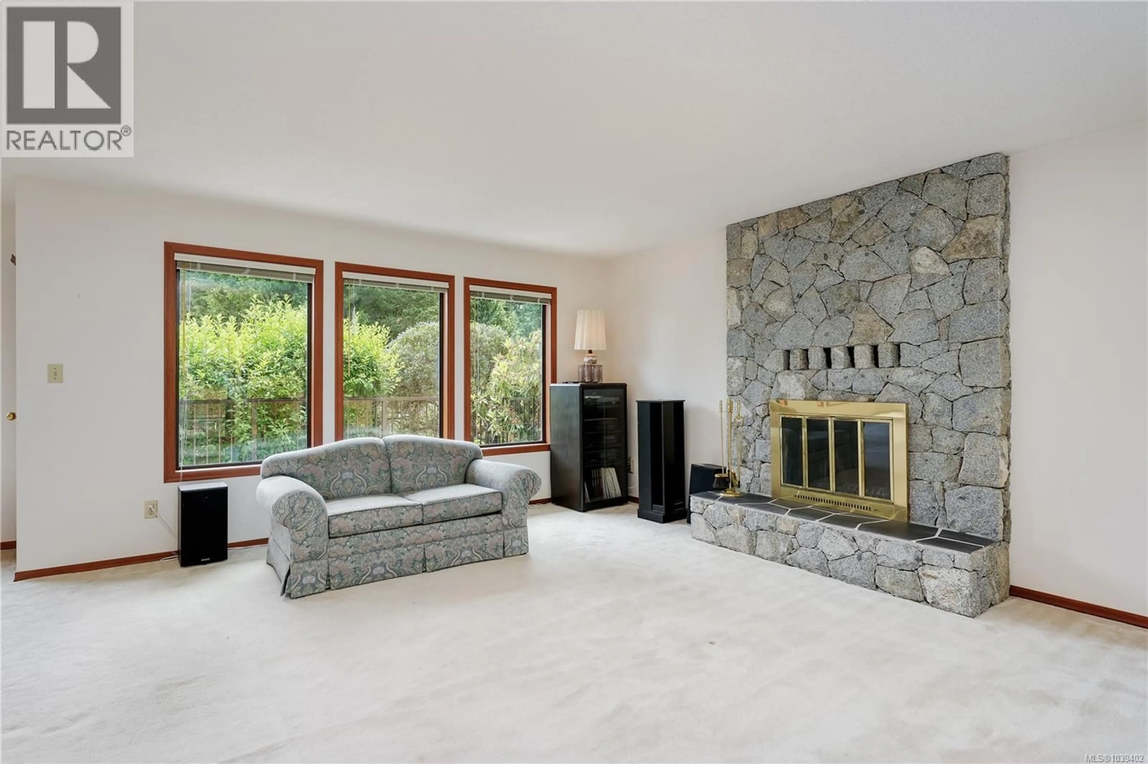 Living room with furniture, ceramic/tile floor for 8587 SANSUM PARK DRIVE, North Saanich British Columbia V8L4V4