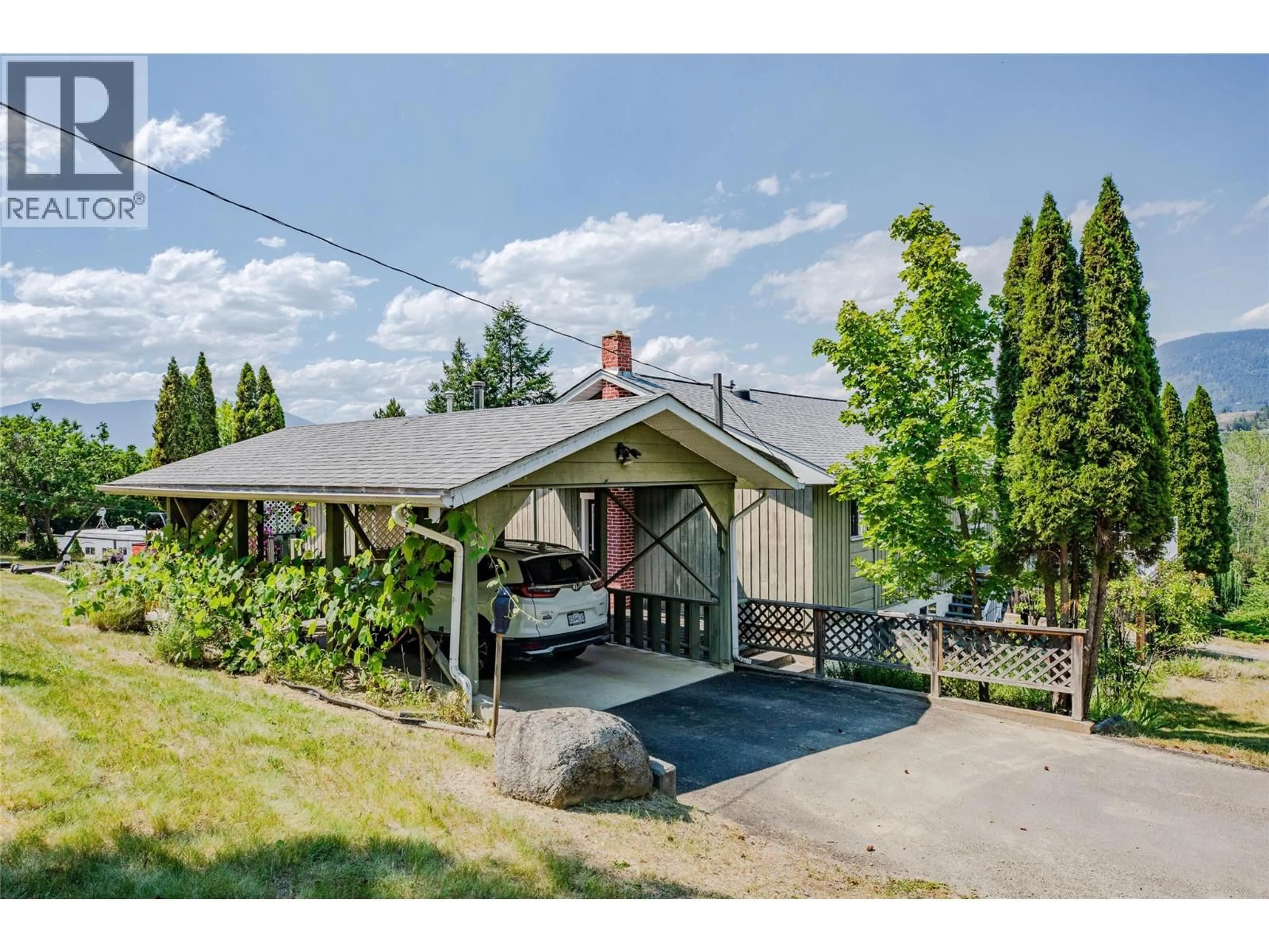 A pic from outside/outdoor area/front of a property/back of a property/a pic from drone, street for 2471 38TH STREET, Creston British Columbia V0B1G2