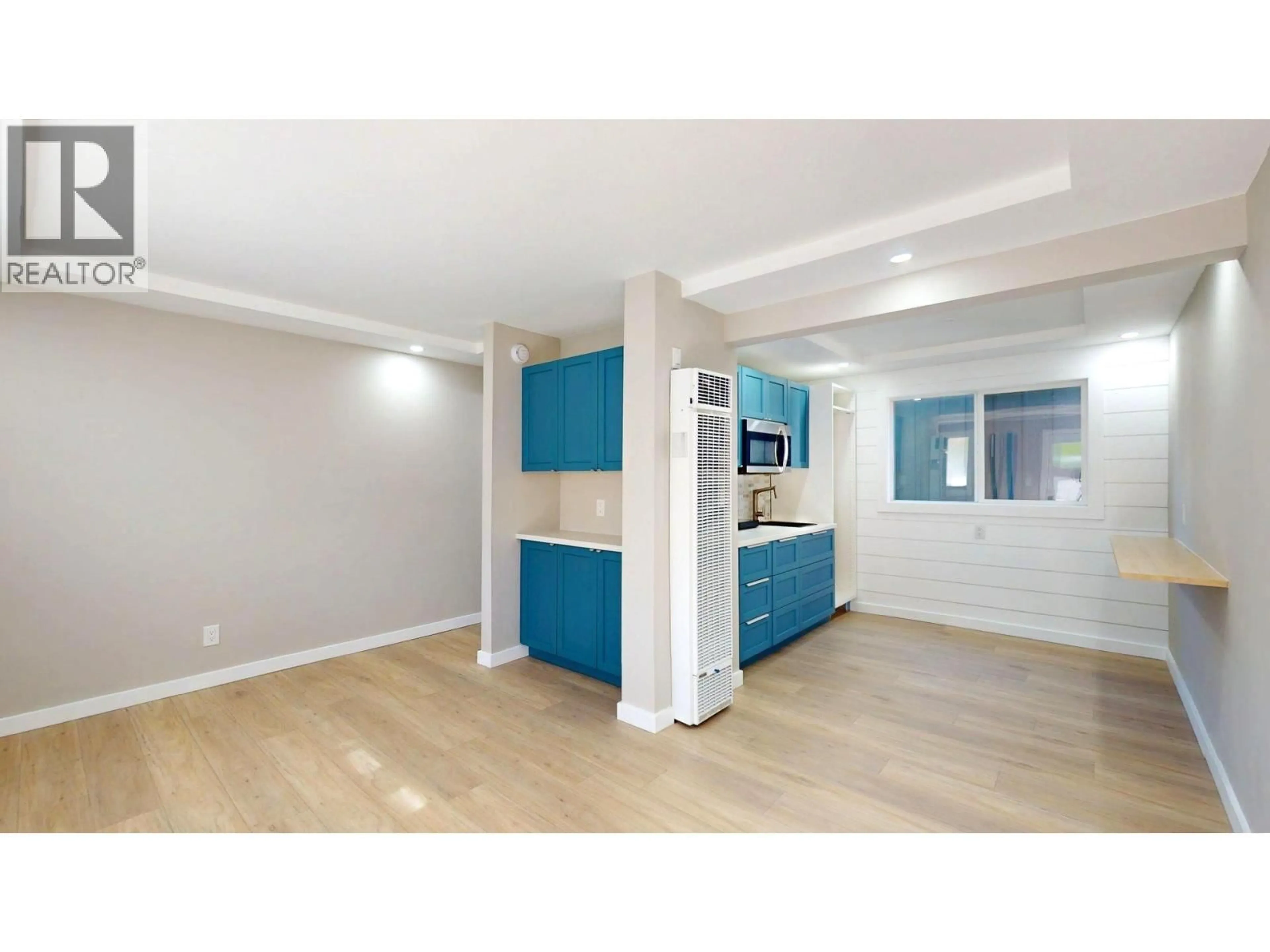 Open concept kitchen, wood/laminate floor for D37 - 100 RED CEDAR DRIVE, Sparwood British Columbia V0B2G0