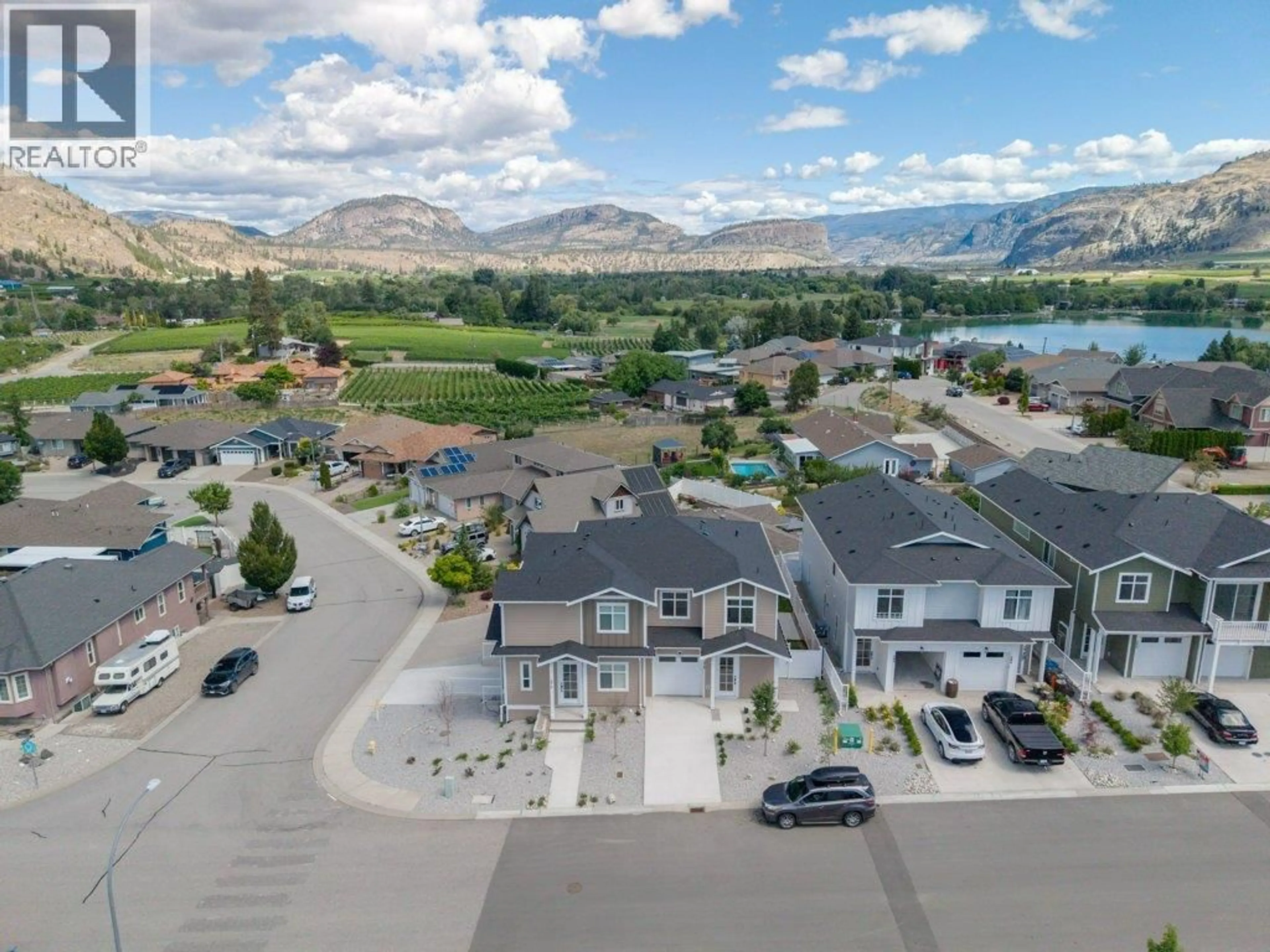 A pic from outside/outdoor area/front of a property/back of a property/a pic from drone, mountain view for 378 CHARDONNAY AVENUE, Oliver British Columbia V0H1T4