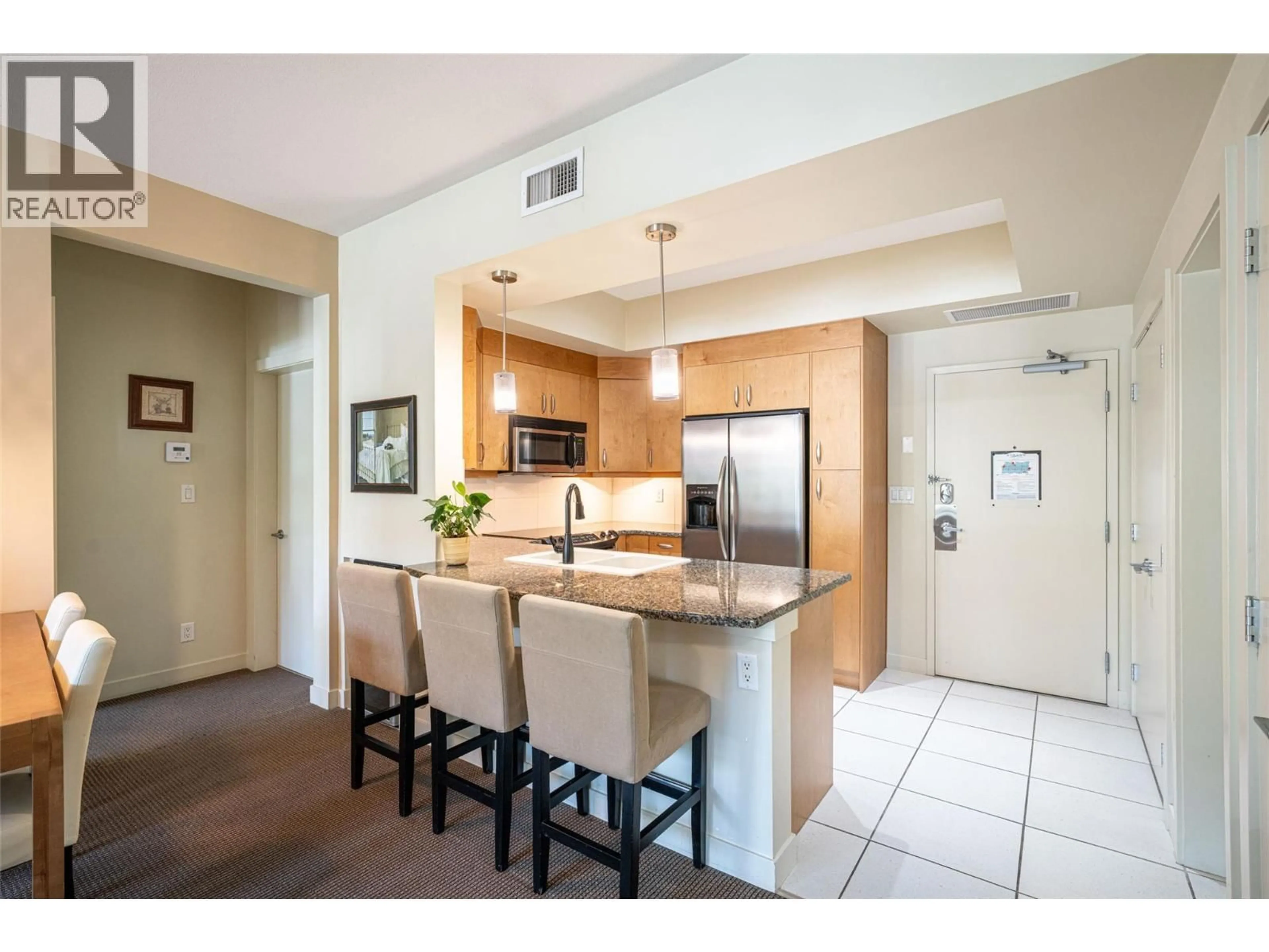 Open concept kitchen, ceramic/tile floor for 2105 - 7343 OKANAGAN LANDING ROAD, Vernon British Columbia V1H2J6