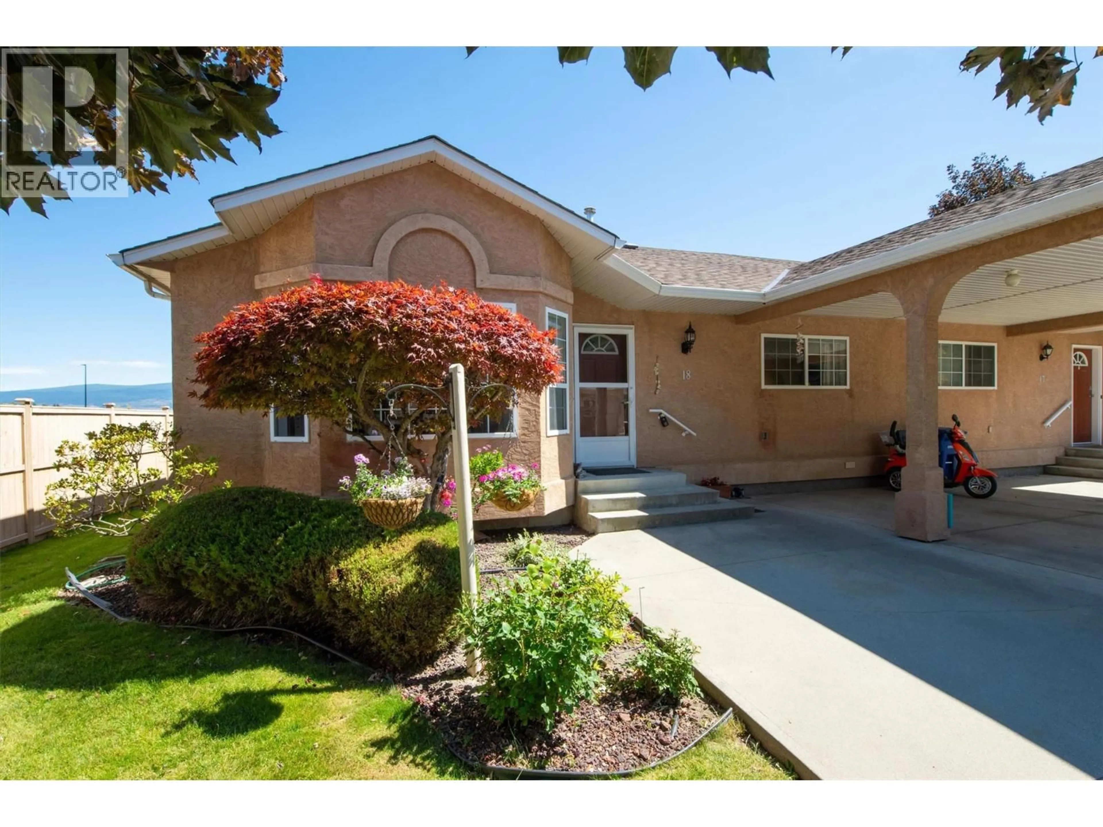 Home with vinyl exterior material, street for 18 - 2210 LOUIE DRIVE, West Kelowna British Columbia V4T2L7