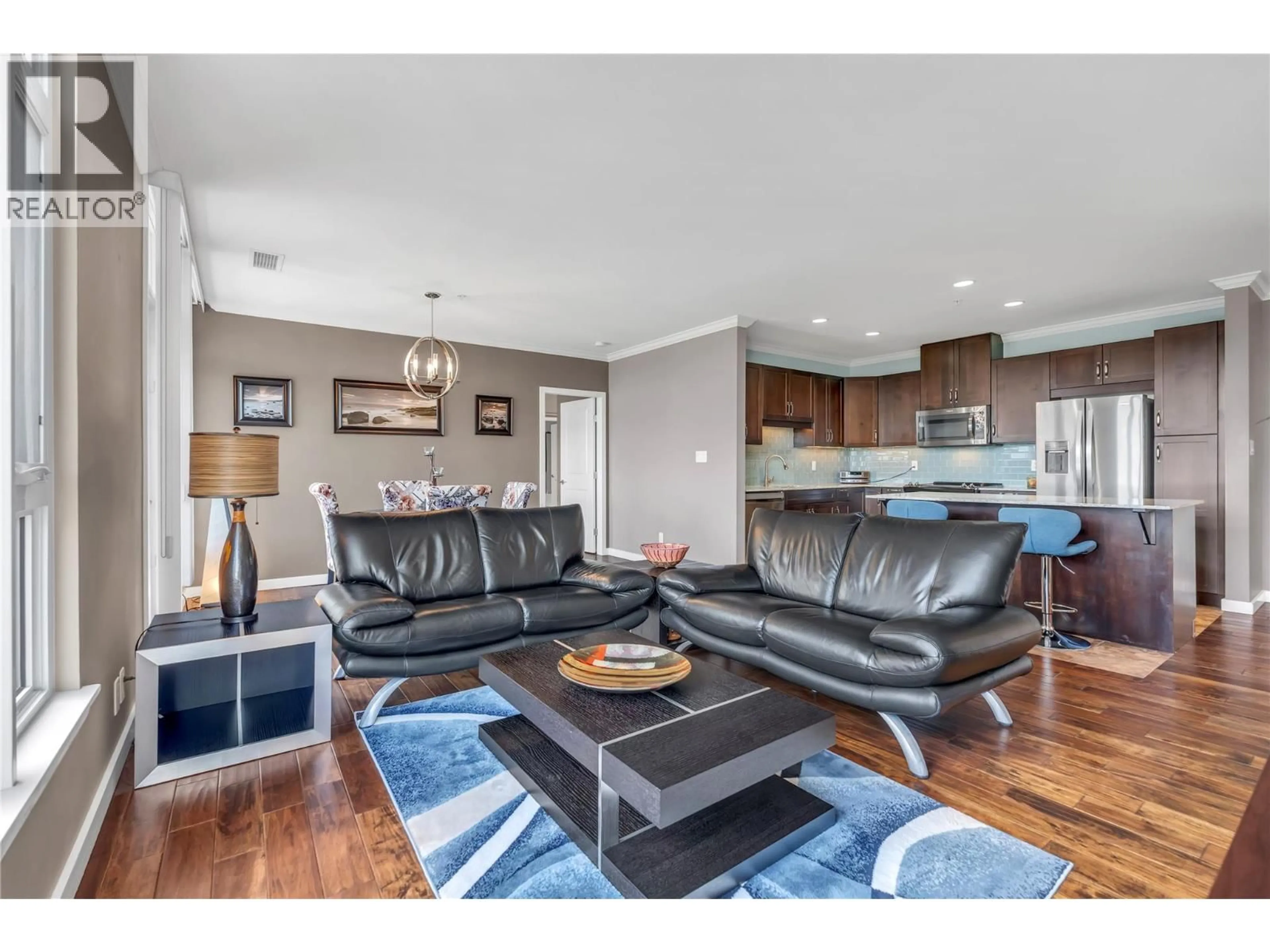 Living room with furniture, wood/laminate floor for 505 - 3301 SKAHA LAKE ROAD, Penticton British Columbia V2A6G6