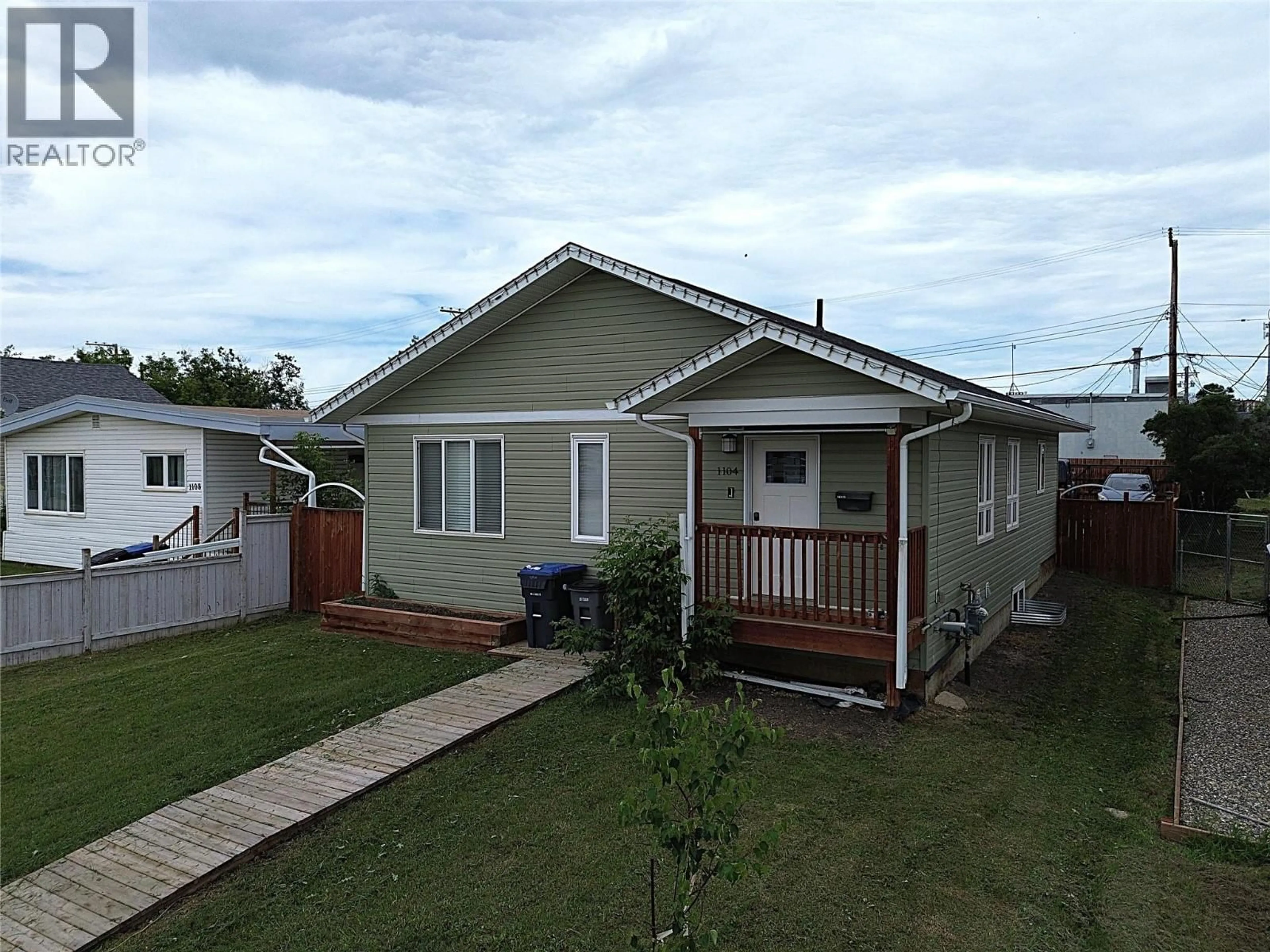 Home with vinyl exterior material, street for 1104 104 AVENUE, Dawson Creek British Columbia V1G2J2