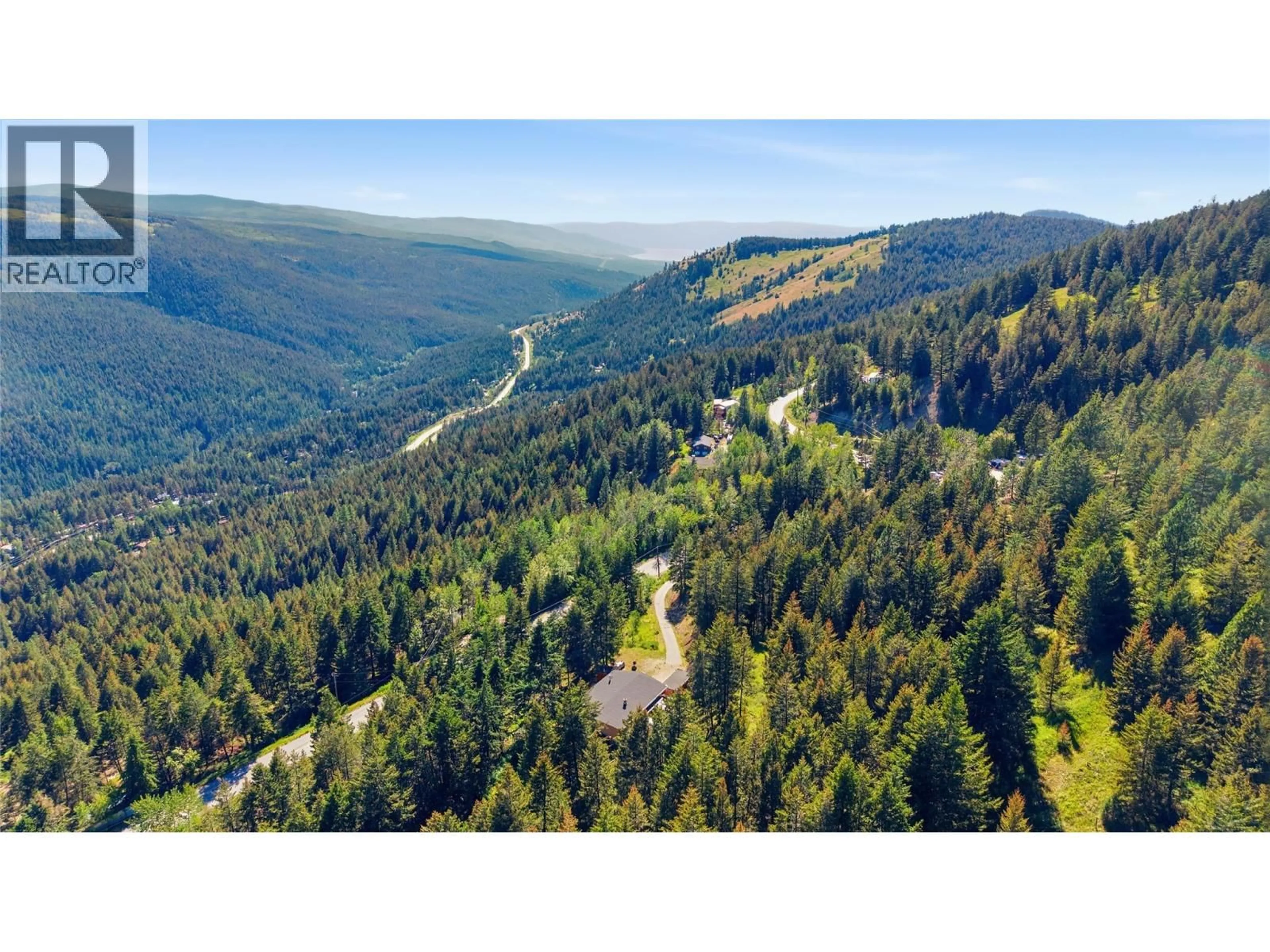 A pic from outside/outdoor area/front of a property/back of a property/a pic from drone, forest/trees view for 8130 SUN VALLEY ROAD, Kelowna British Columbia V1P1M3