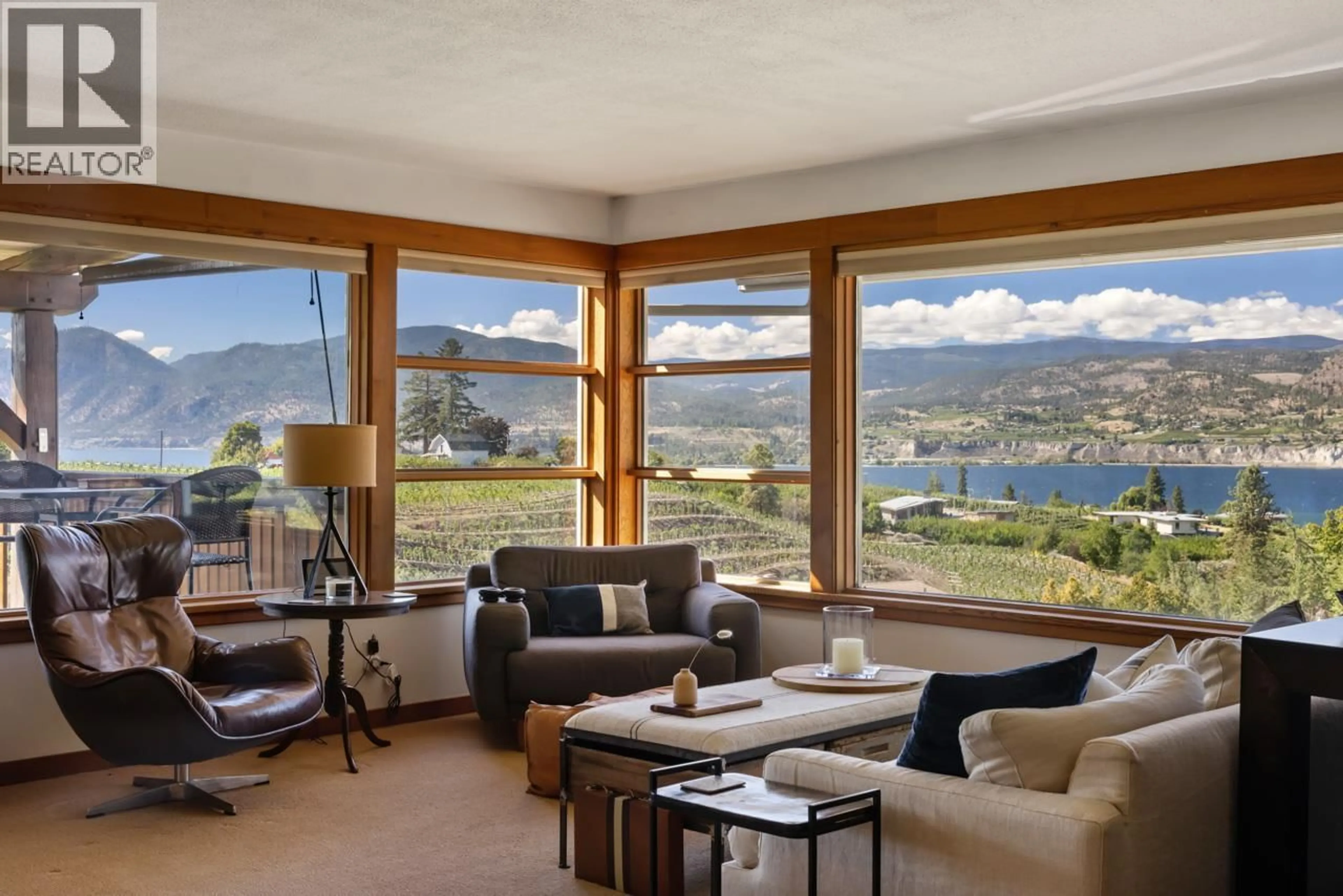 Living room with furniture, wood/laminate floor for 4320 GULCH ROAD, Naramata British Columbia V0H1N0