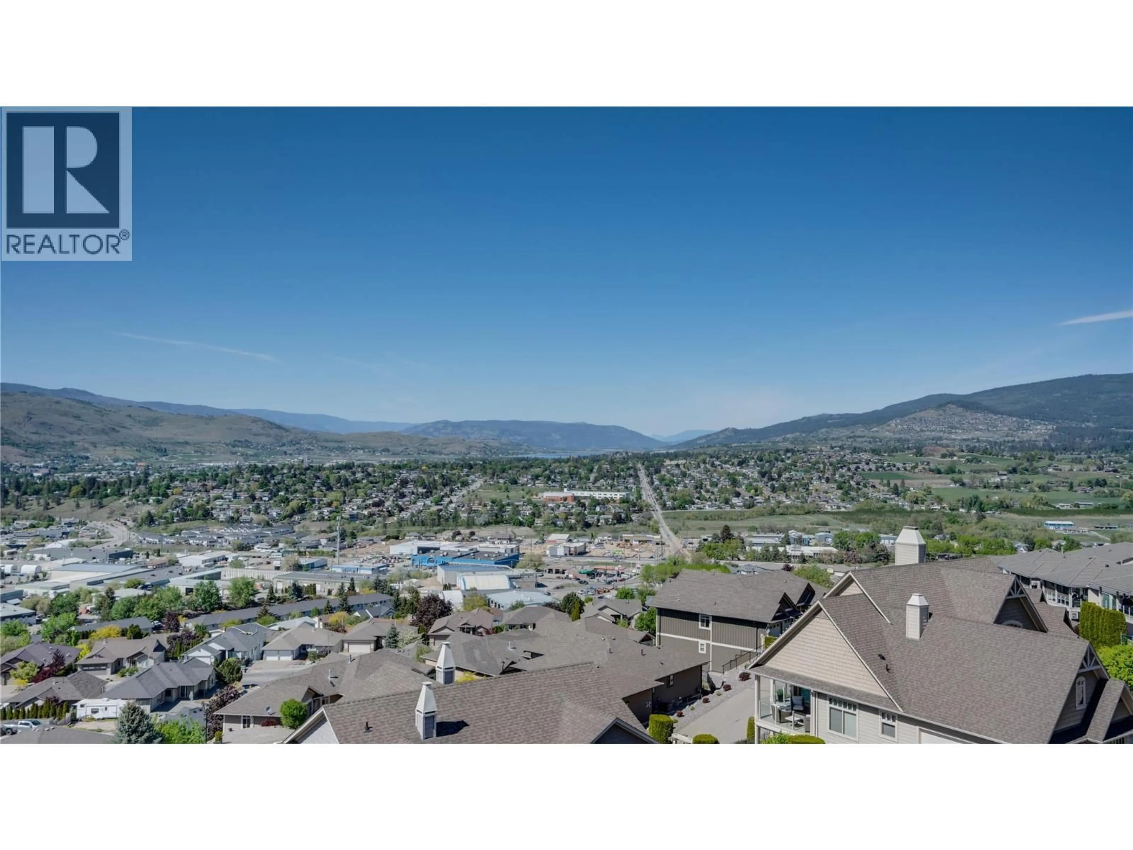 A pic from outside/outdoor area/front of a property/back of a property/a pic from drone, mountain view for 4 - 1050 MT. REVELSTOKE PLACE, Vernon British Columbia V1B2N4
