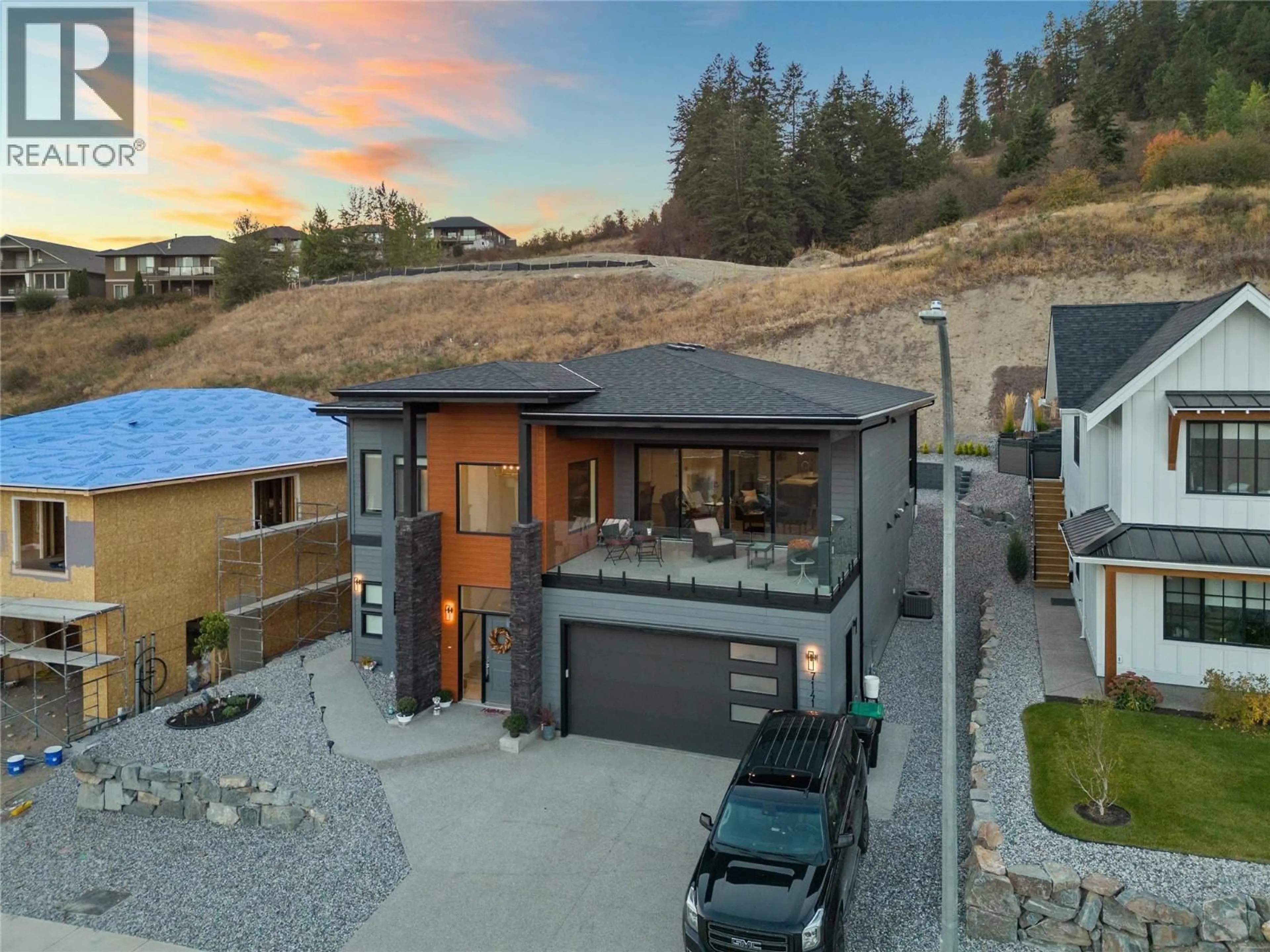 A pic from outside/outdoor area/front of a property/back of a property/a pic from drone, street for 7141 NAKISKA DRIVE, Vernon British Columbia V1B3M5
