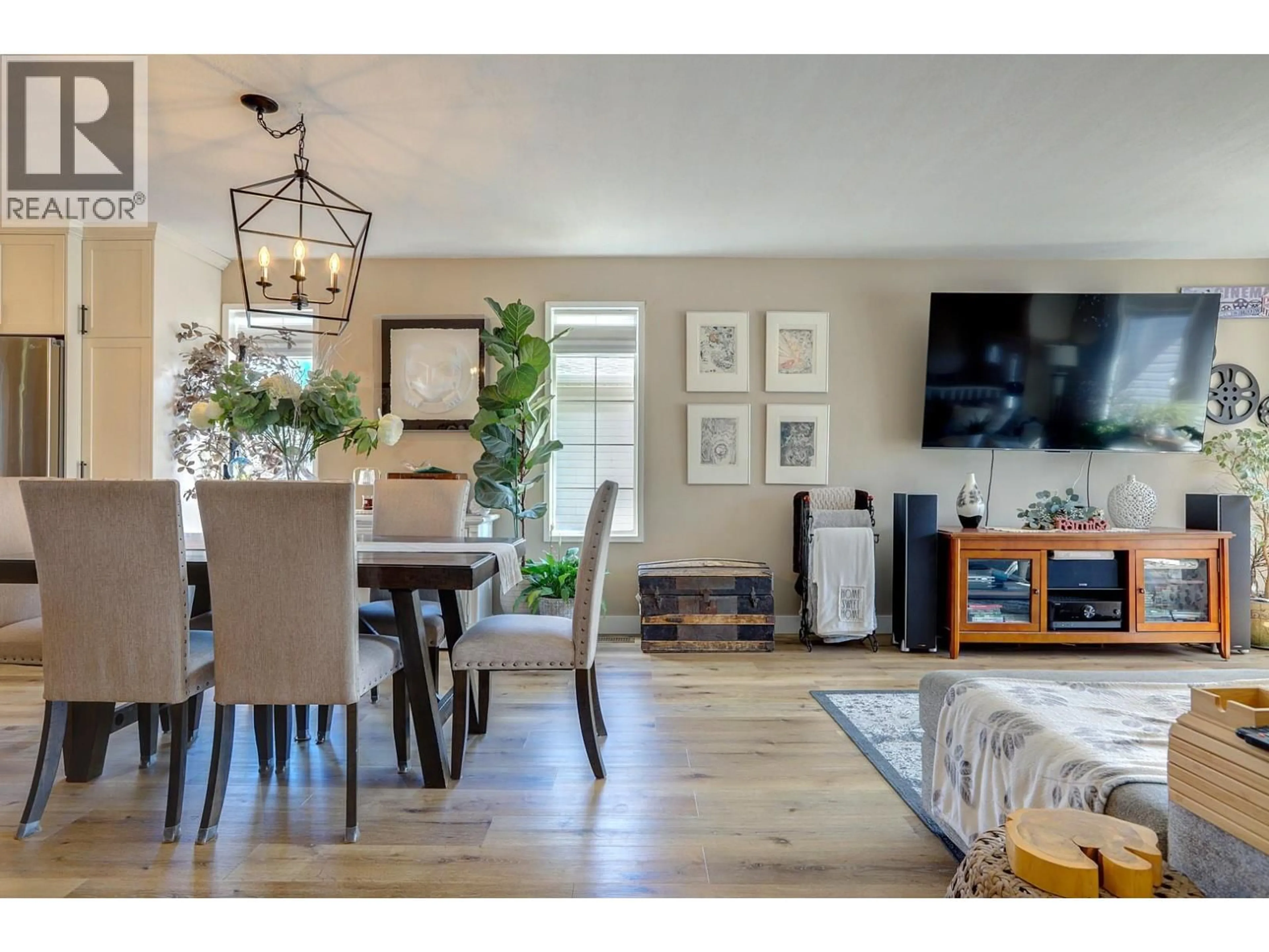 Living room with furniture, wood/laminate floor for 3730 COMMONAGE PLACE, Vernon British Columbia V1T8V6