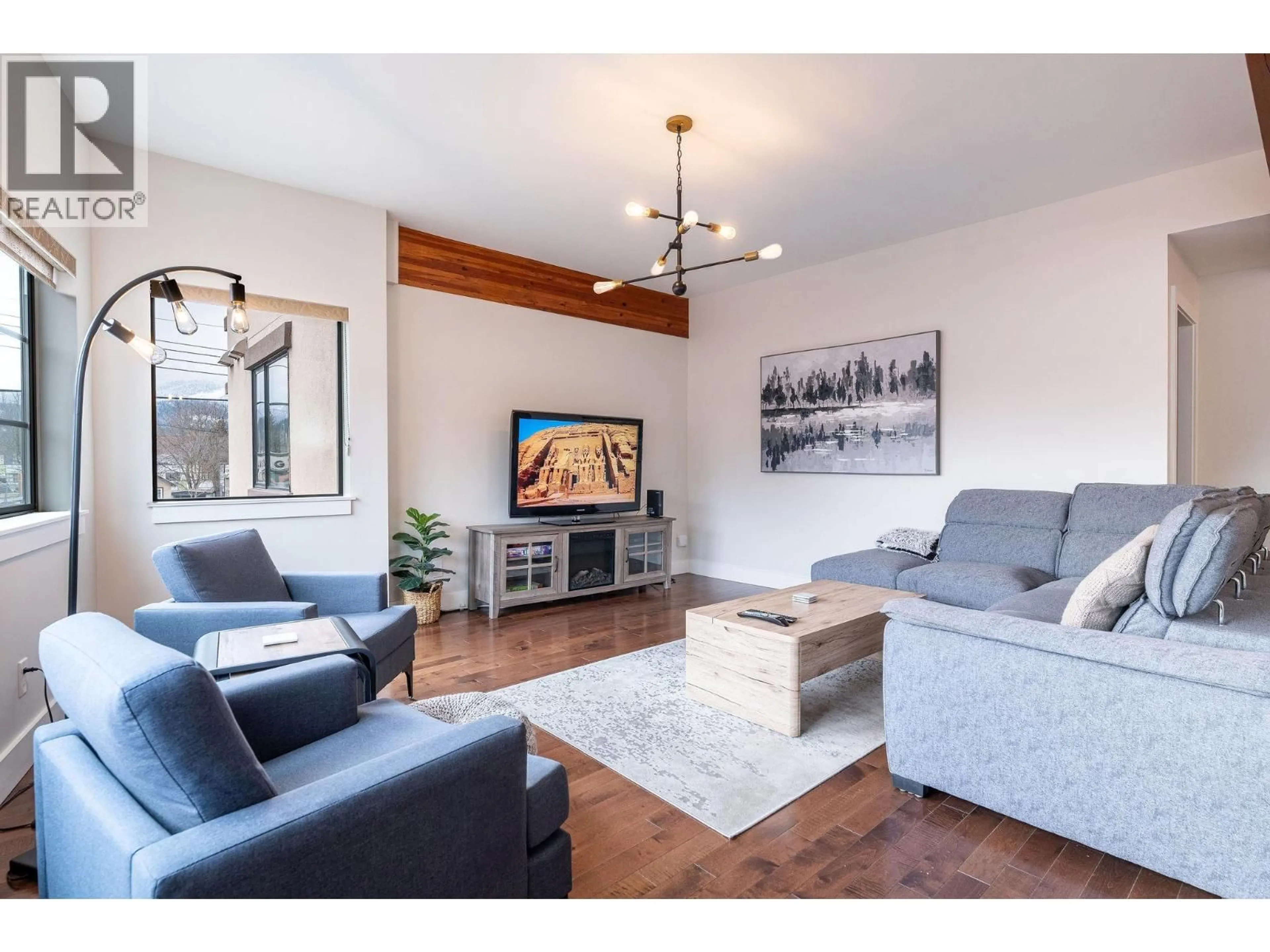 Living room with furniture, wood/laminate floor for 203 - 309 FIRST STREET WEST, Revelstoke British Columbia V0E2S0