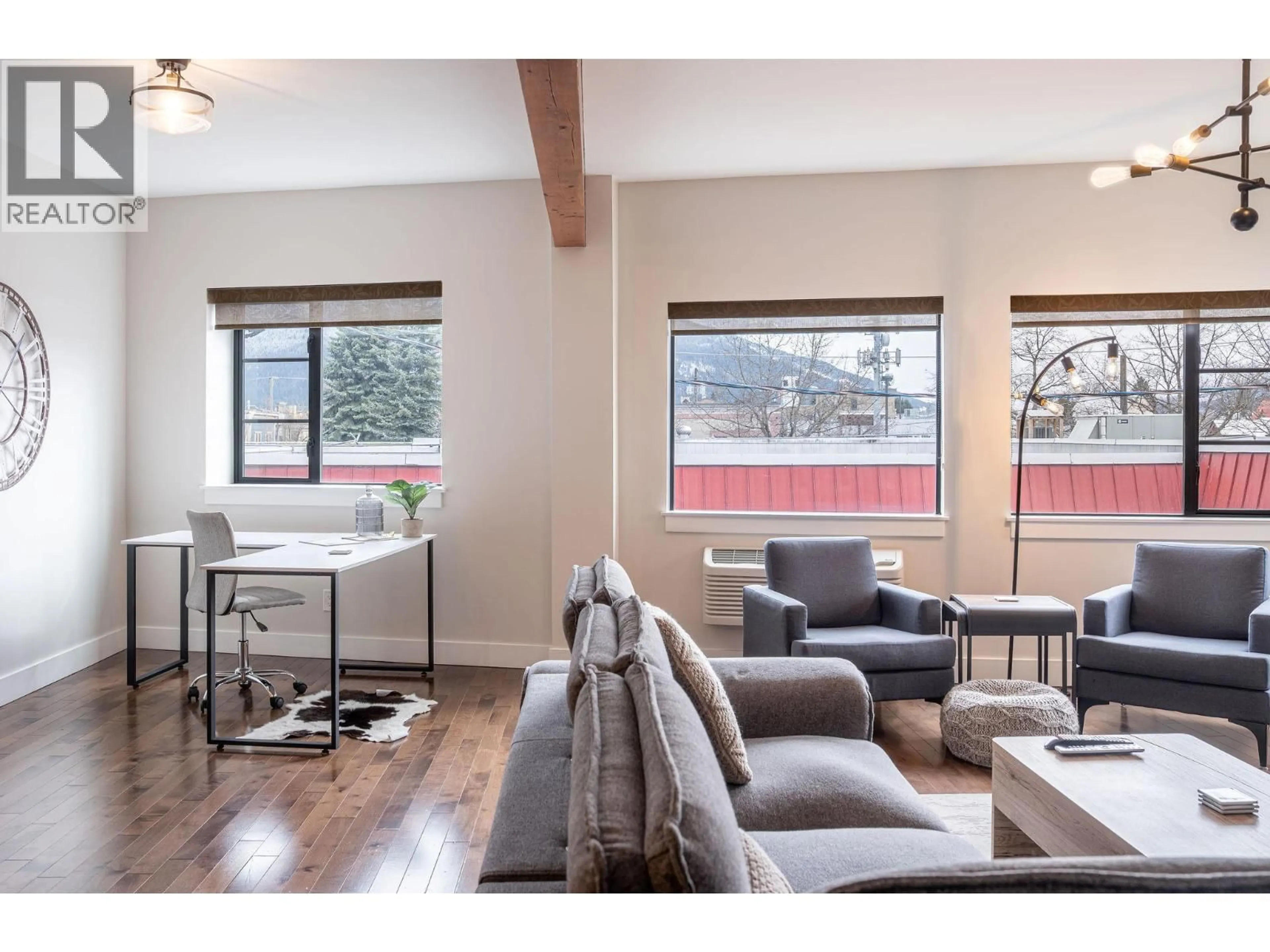 Living room with furniture, wood/laminate floor for 203 - 309 FIRST STREET WEST, Revelstoke British Columbia V0E2S0