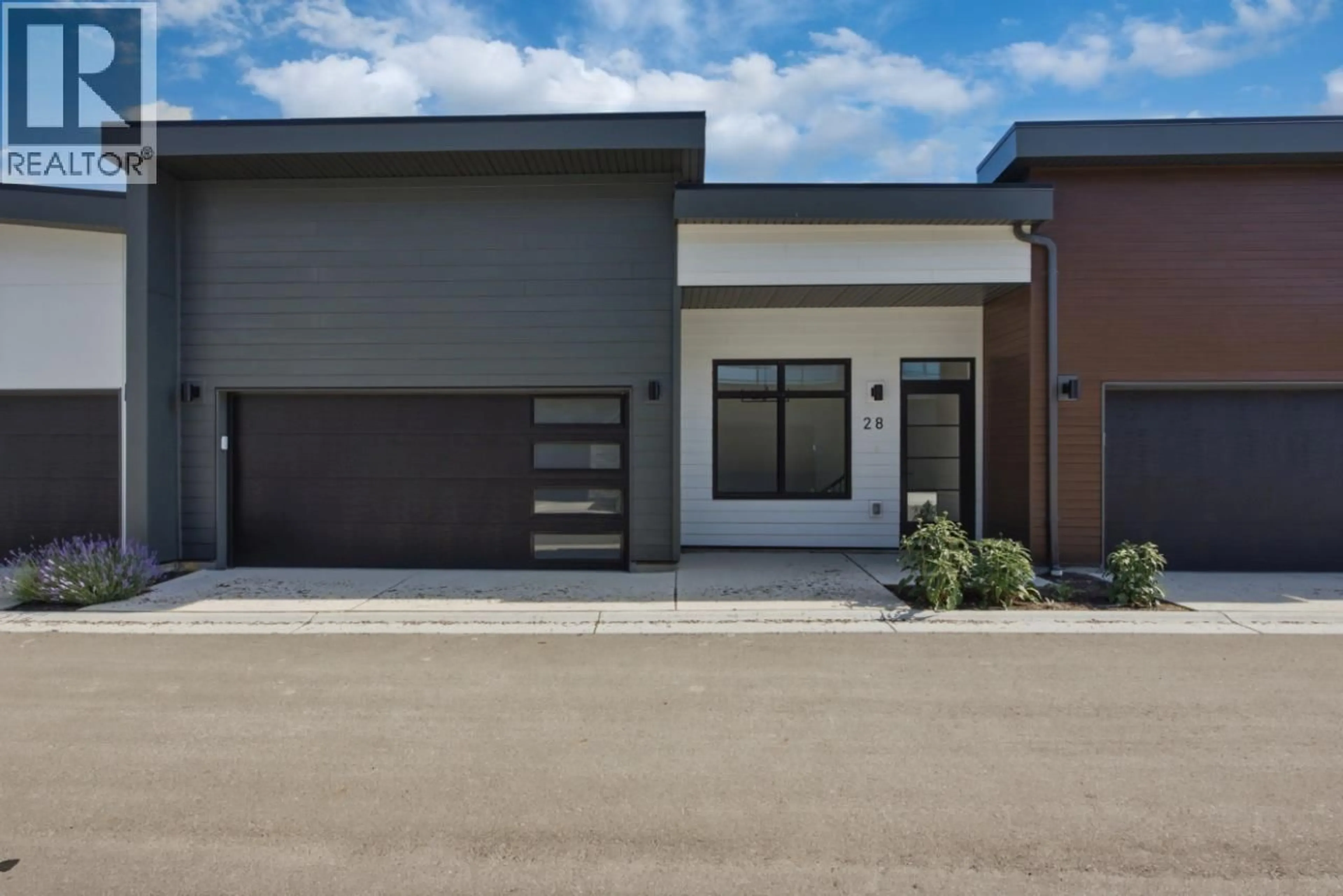 Home with brick exterior material, street for 28 - 7599 KLINGER ROAD, Okanagan Landing British Columbia V1H0B2