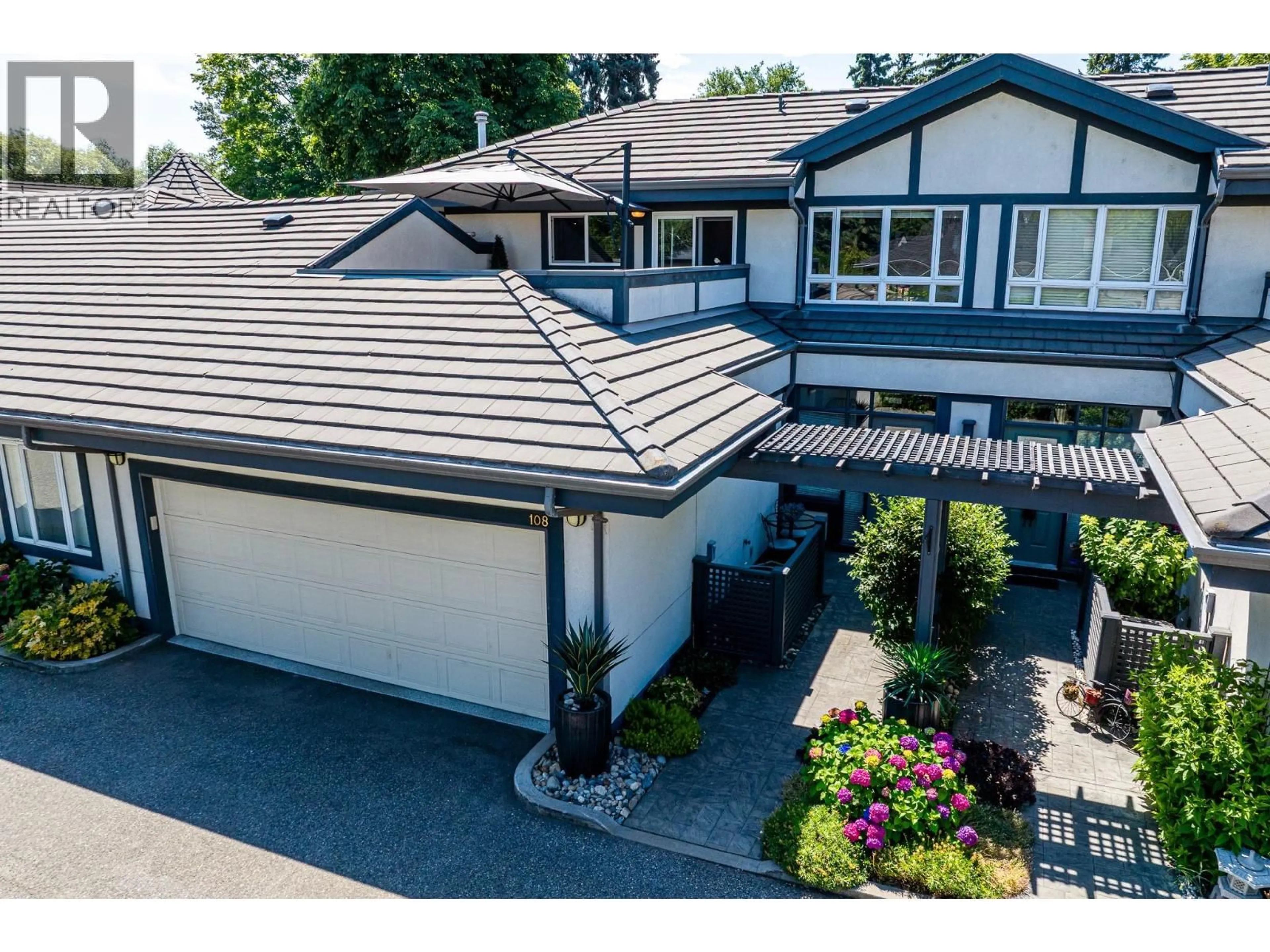 A pic from outside/outdoor area/front of a property/back of a property/a pic from drone, street for 108 - 1986 BOWES STREET, Kelowna British Columbia V1Y3C3