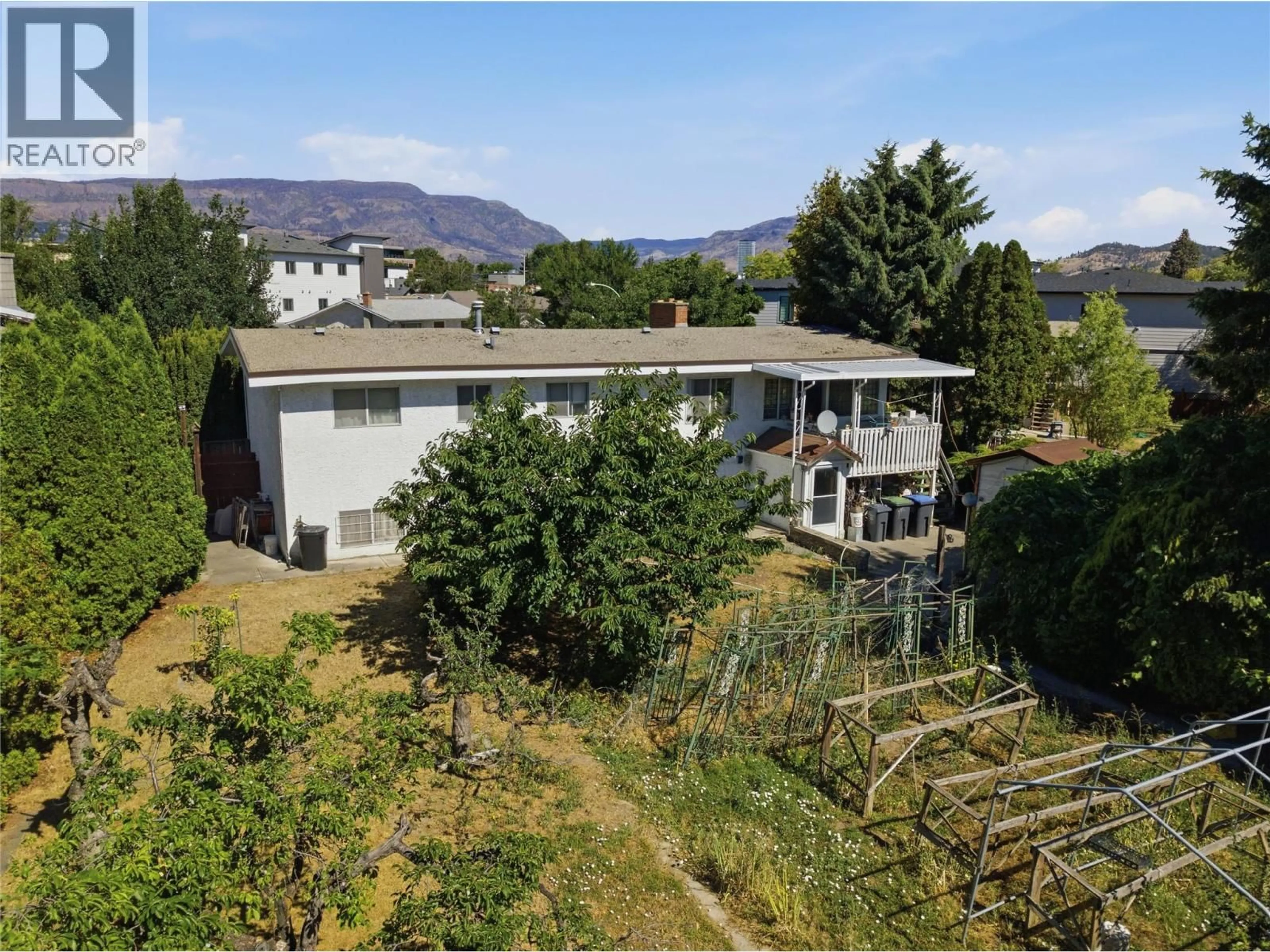 A pic from outside/outdoor area/front of a property/back of a property/a pic from drone, mountain view for 766 COOPLAND CRESCENT, Kelowna British Columbia V1Y2V1