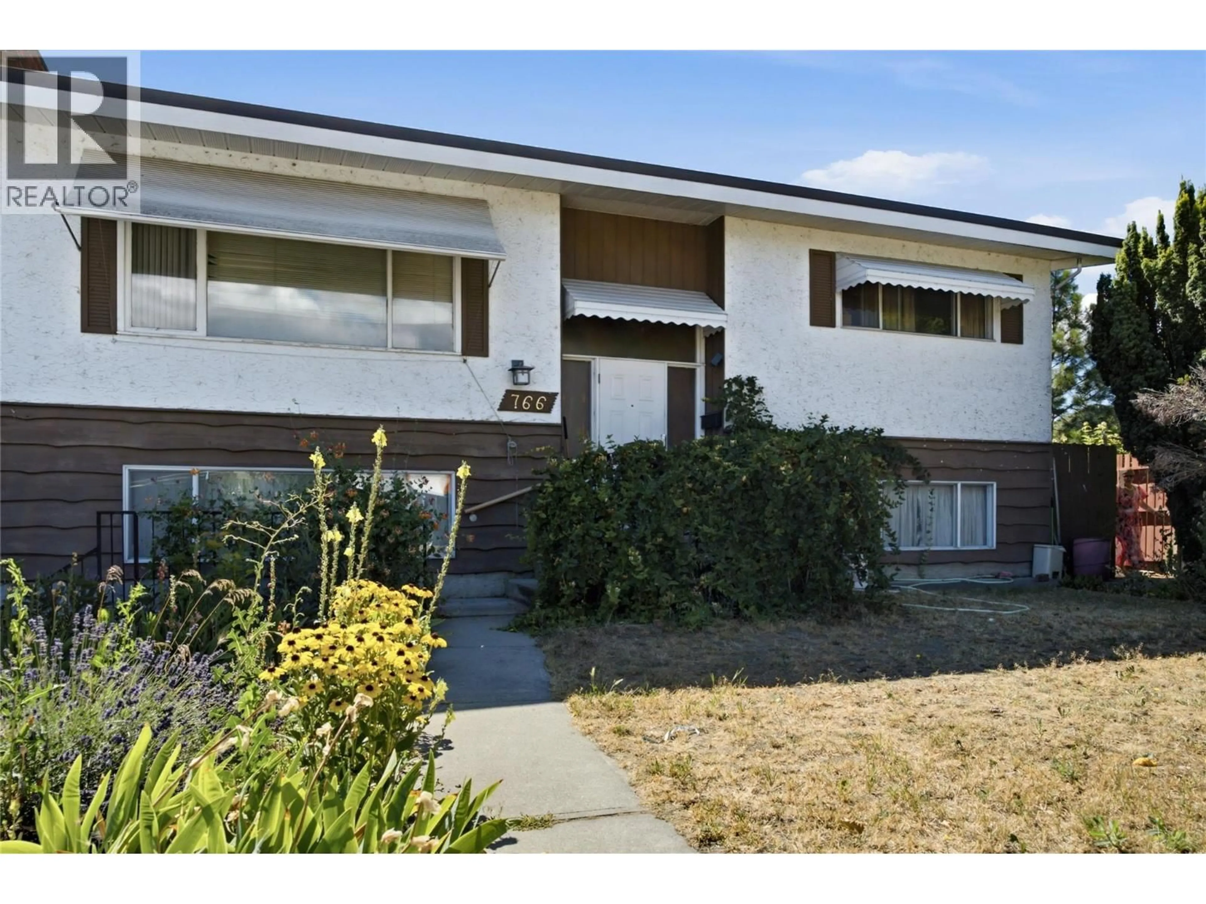 Home with vinyl exterior material, street for 766 COOPLAND CRESCENT, Kelowna British Columbia V1Y2V1